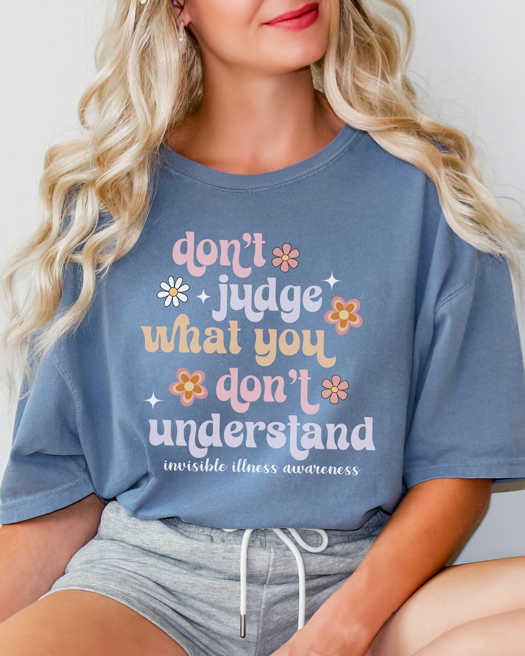 Girl wearing Comfort Colors invisible illness awareness shirt in blue jean