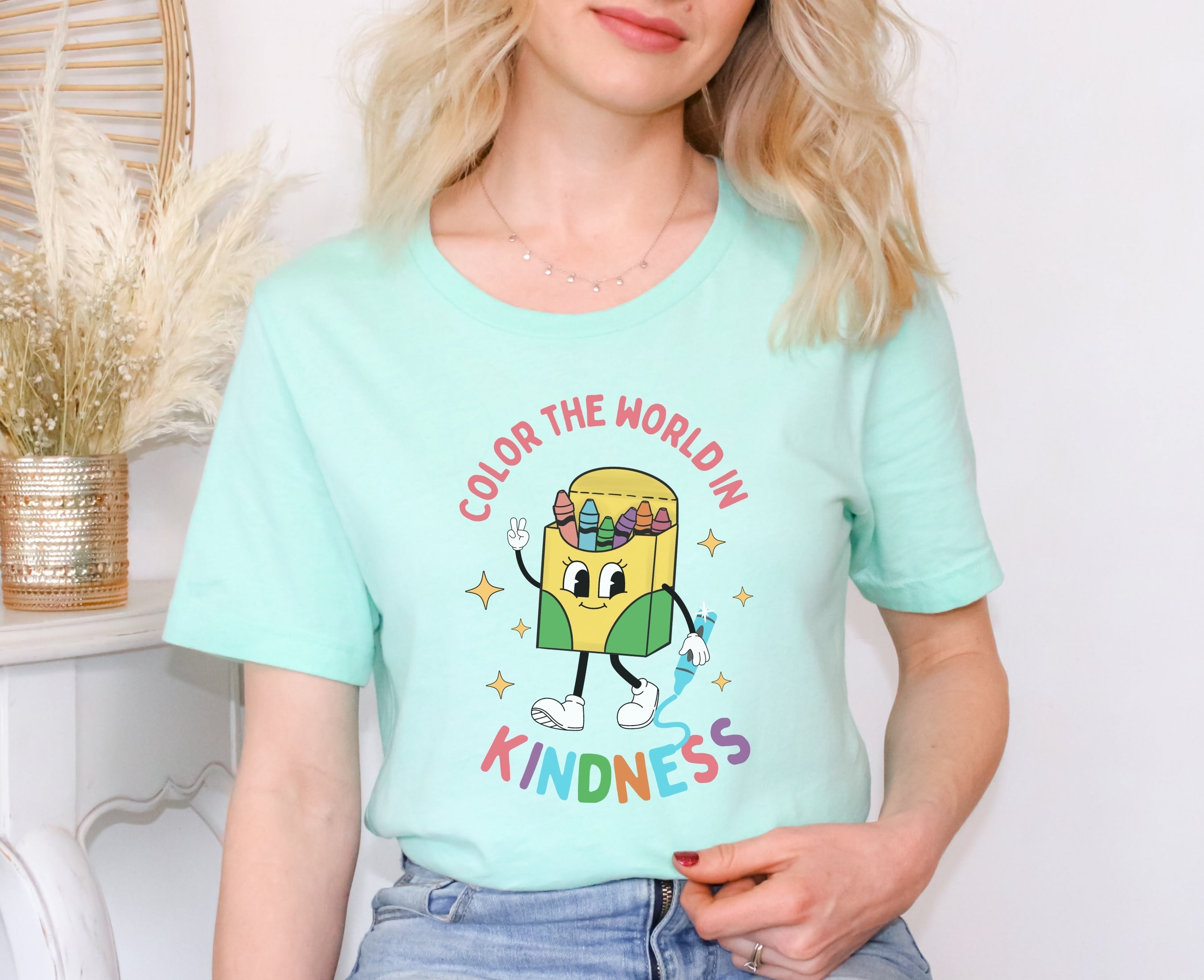 Teacher wearing Mint crayon box character kindness shirt