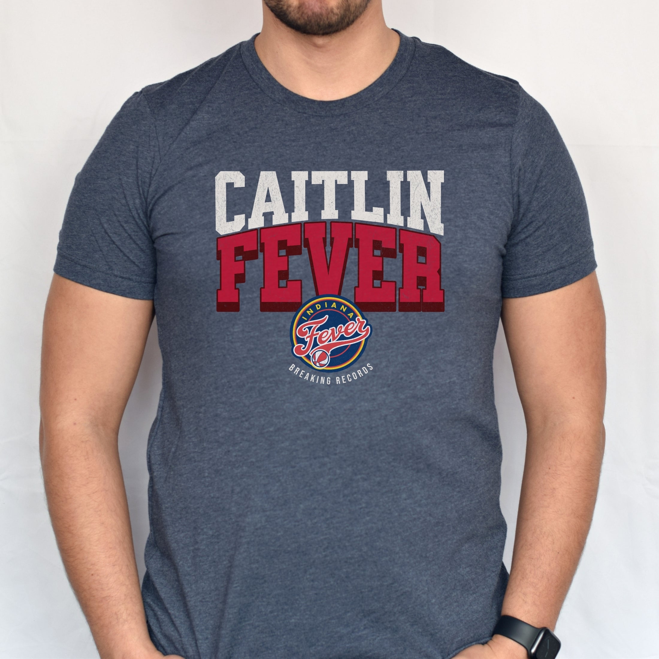 Man wearing heather navy Caitlin Fever shirt