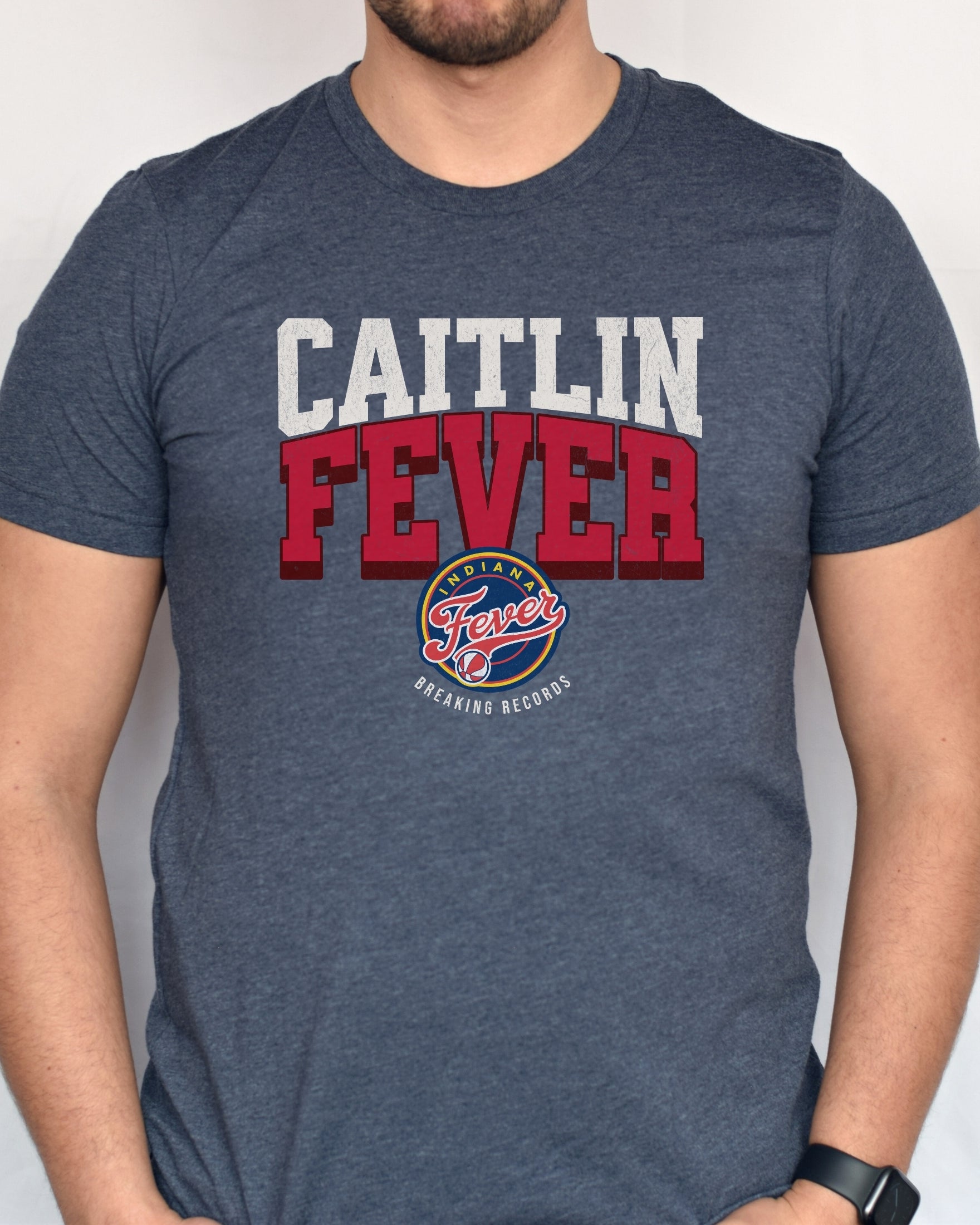 Man wearing heather navy Caitlin Fever shirt