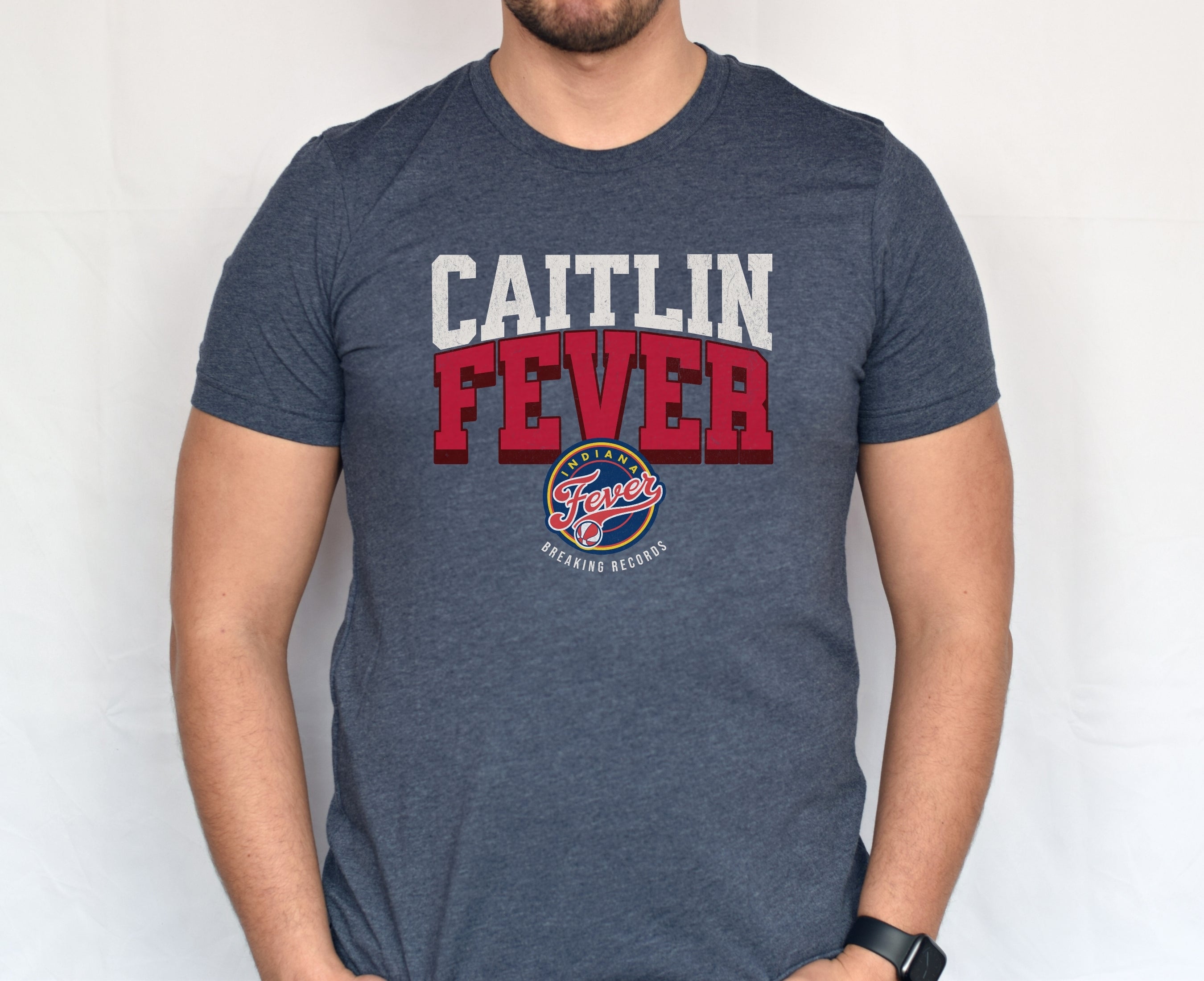 Man wearing heather navy Caitlin Fever shirt
