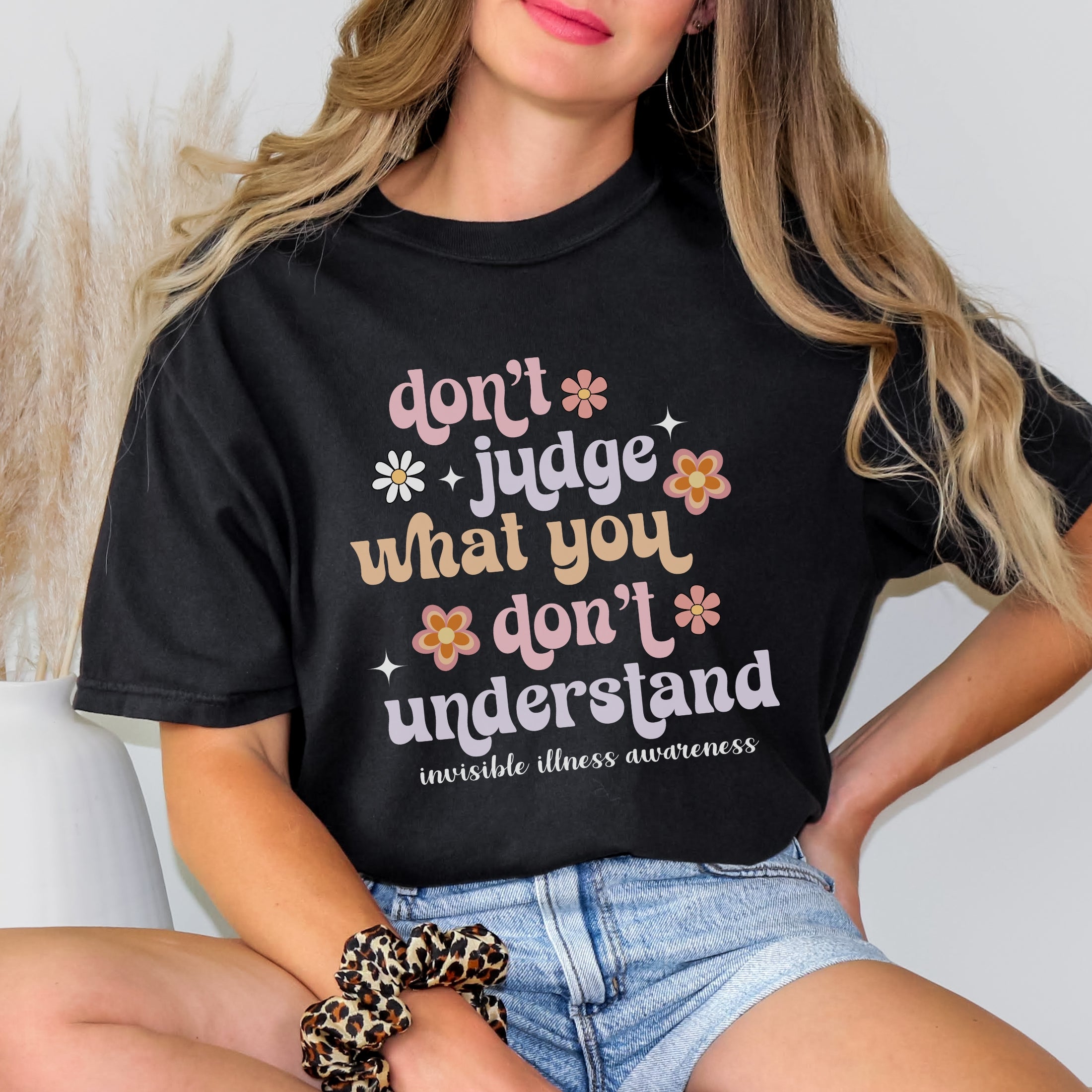 Girl wearing Comfort Colors invisible illness awareness shirt in black