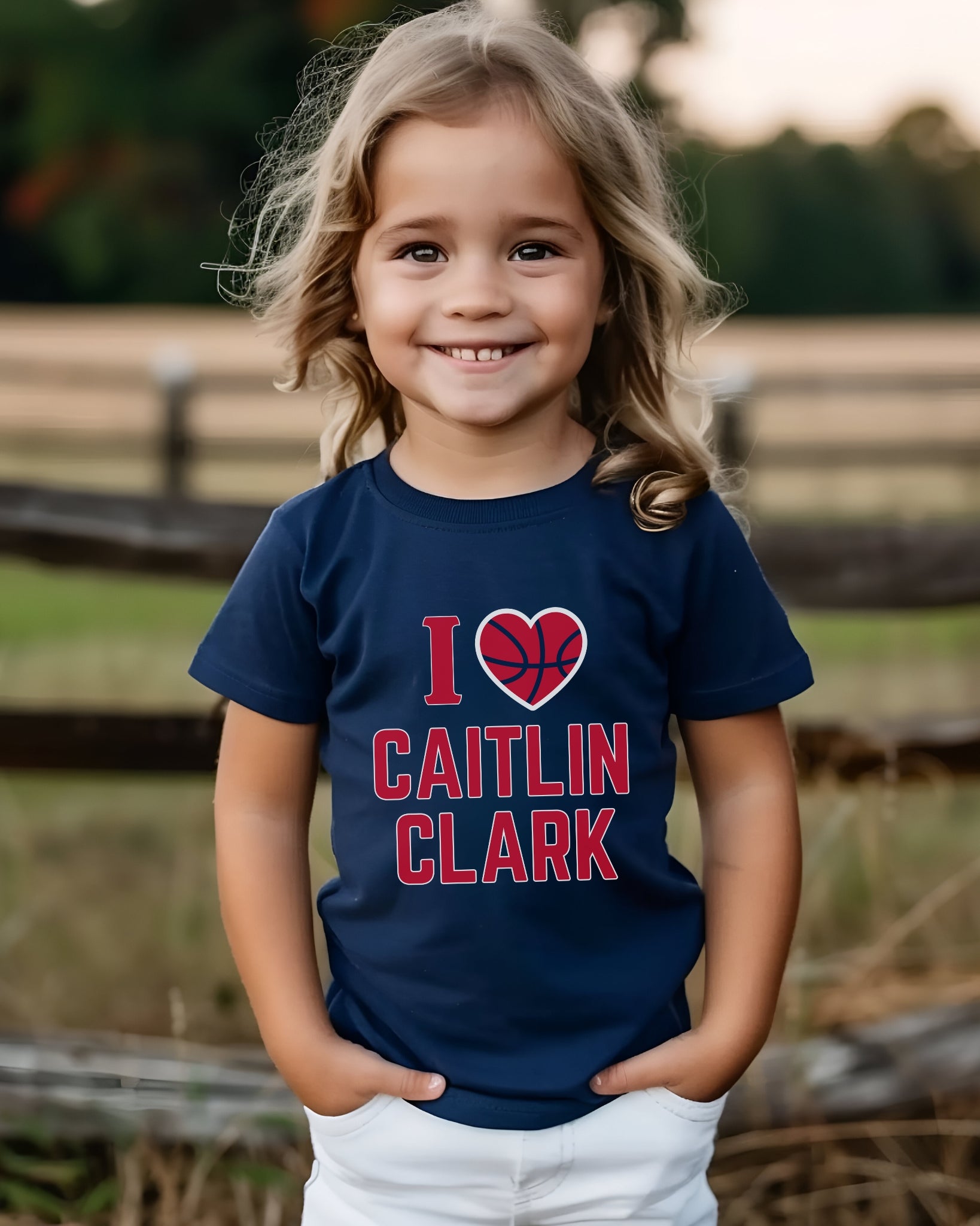 Little girl wearing I love Caitlin Clark navy t-shirt
