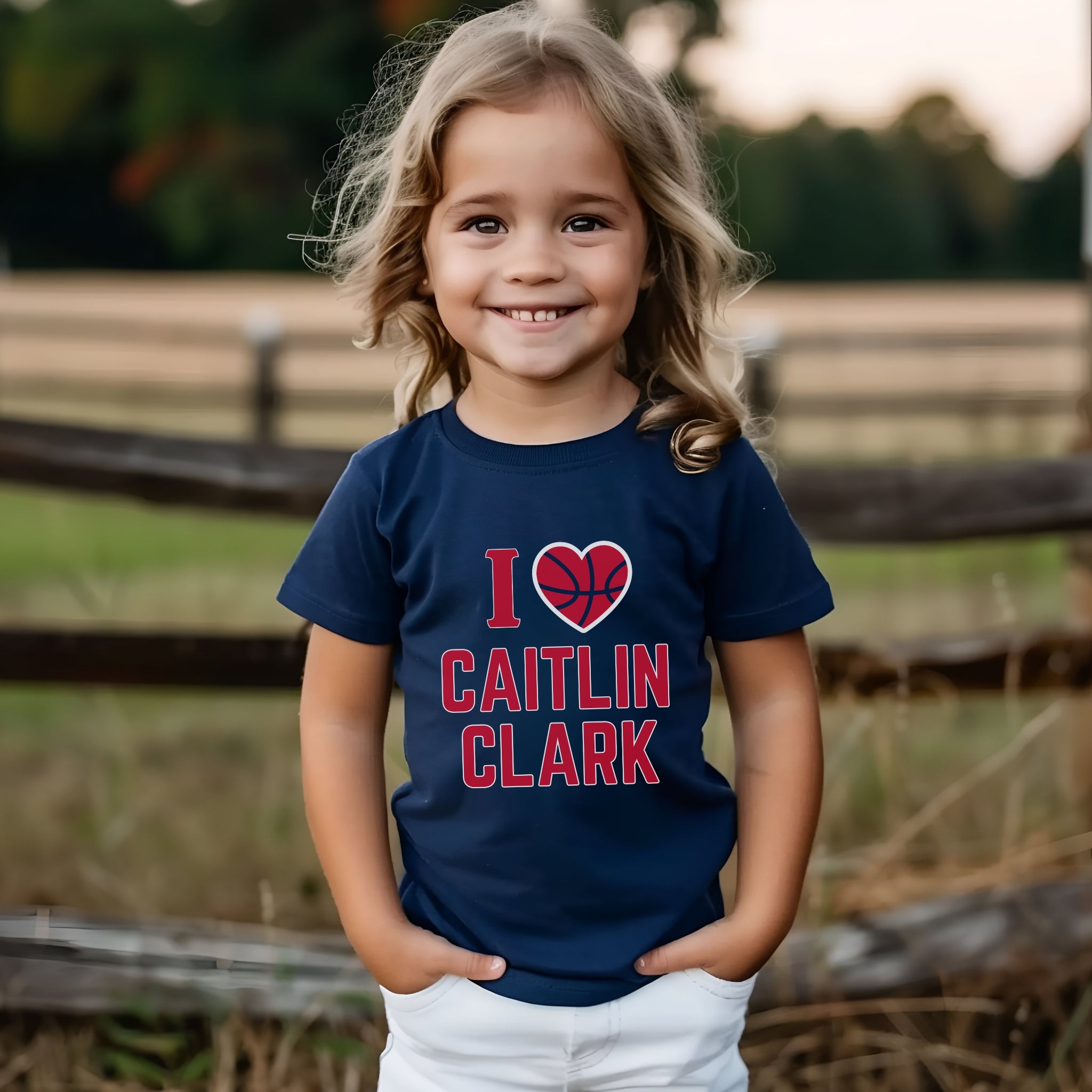 Little girl wearing I love Caitlin Clark navy t-shirt