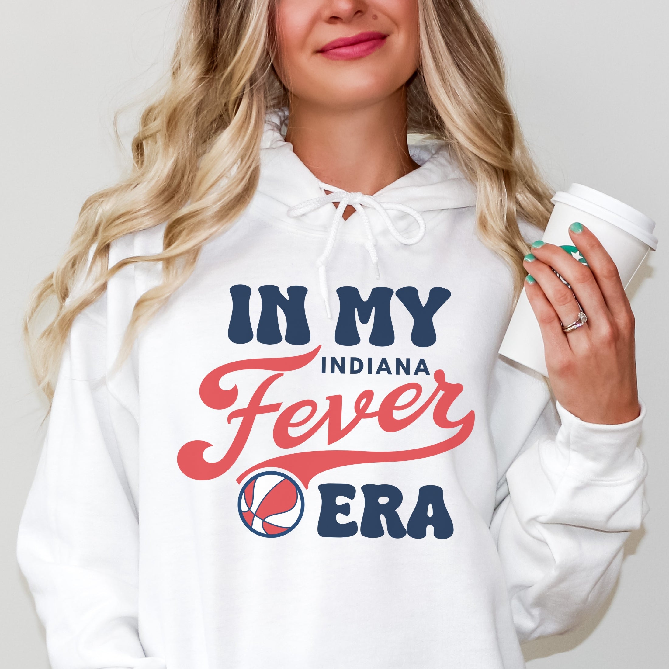 Girl wearing white in my Fever era hoodie