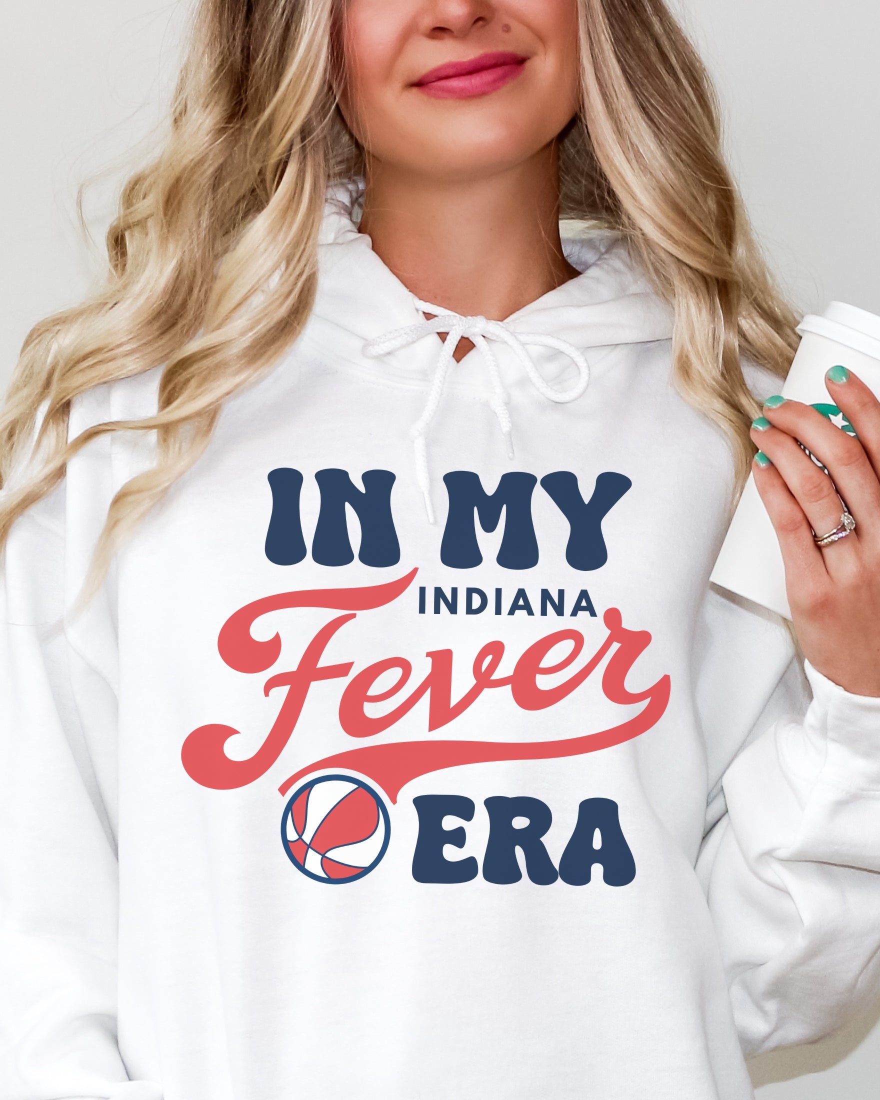 Girl wearing white in my Fever era hoodie