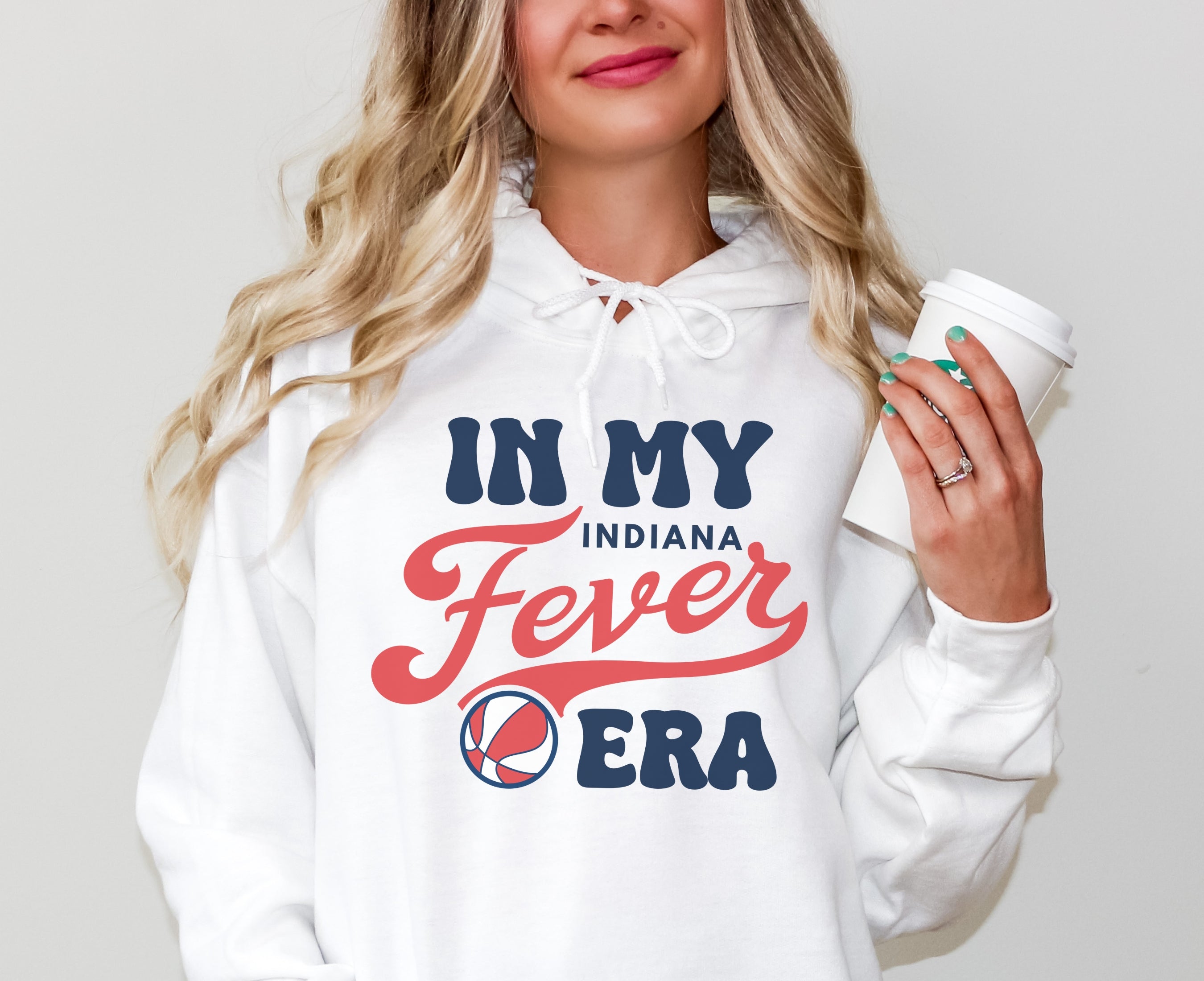 Girl wearing white in my Fever era hoodie