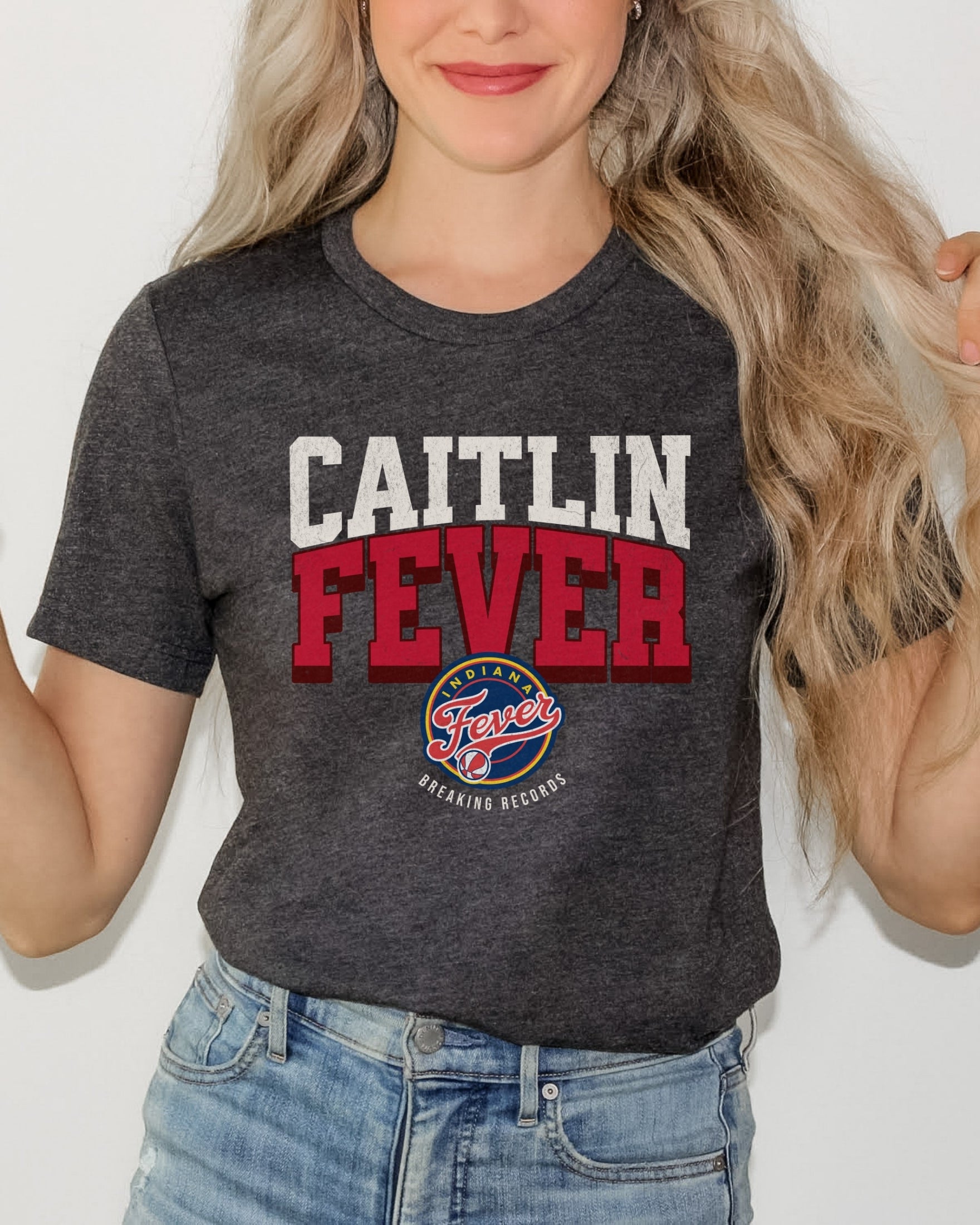 Woman wearing Dark Grey Heather Caitlin Fever shirt