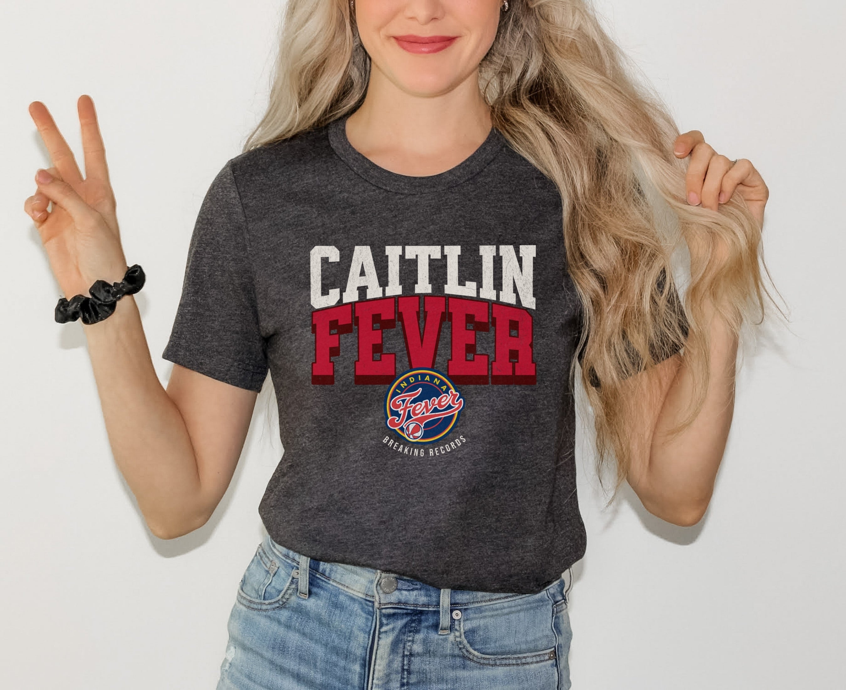 Woman wearing Dark Grey Heather Caitlin Fever shirt
