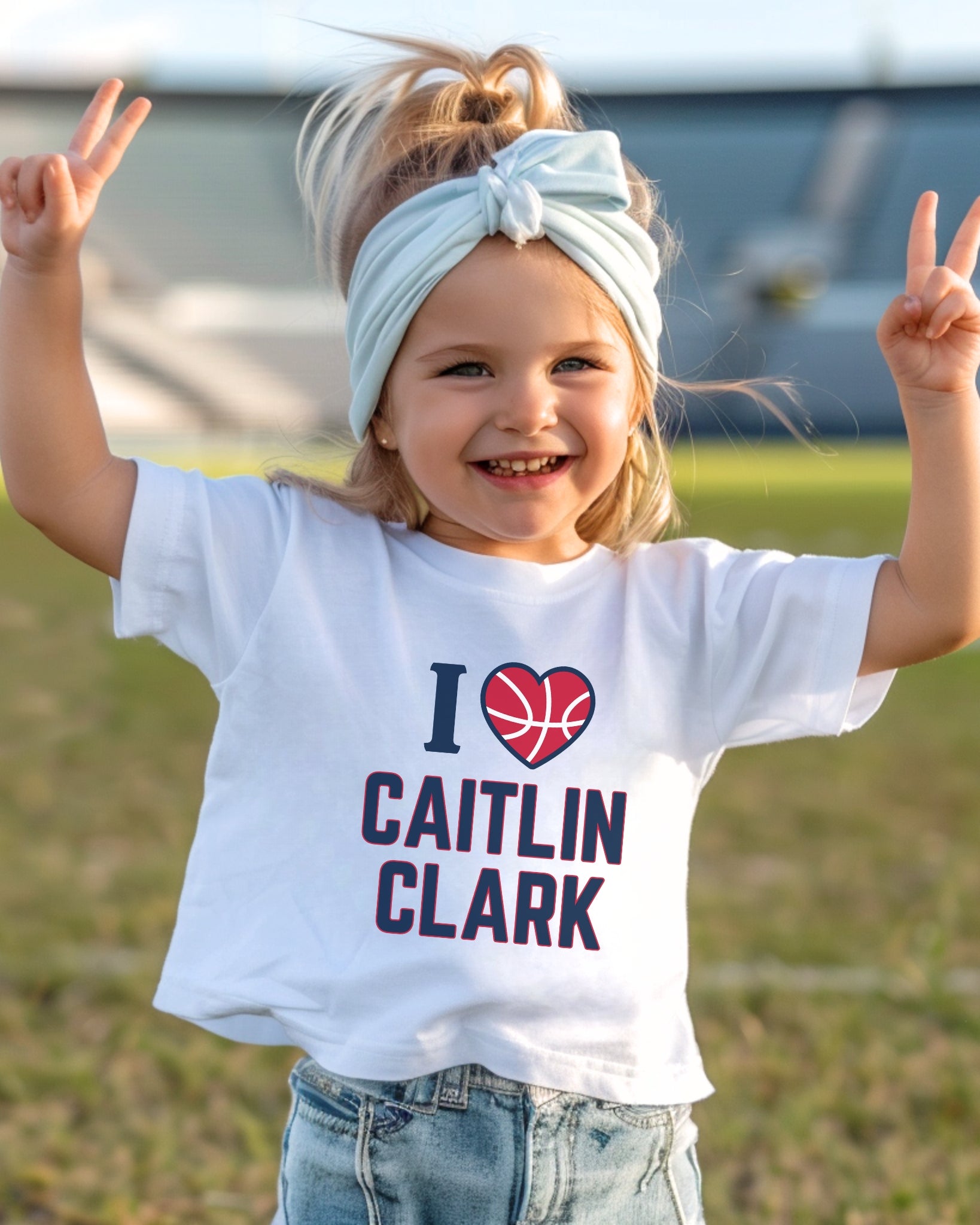 Little girl wearing white I love Caitlin Clark t-shirt