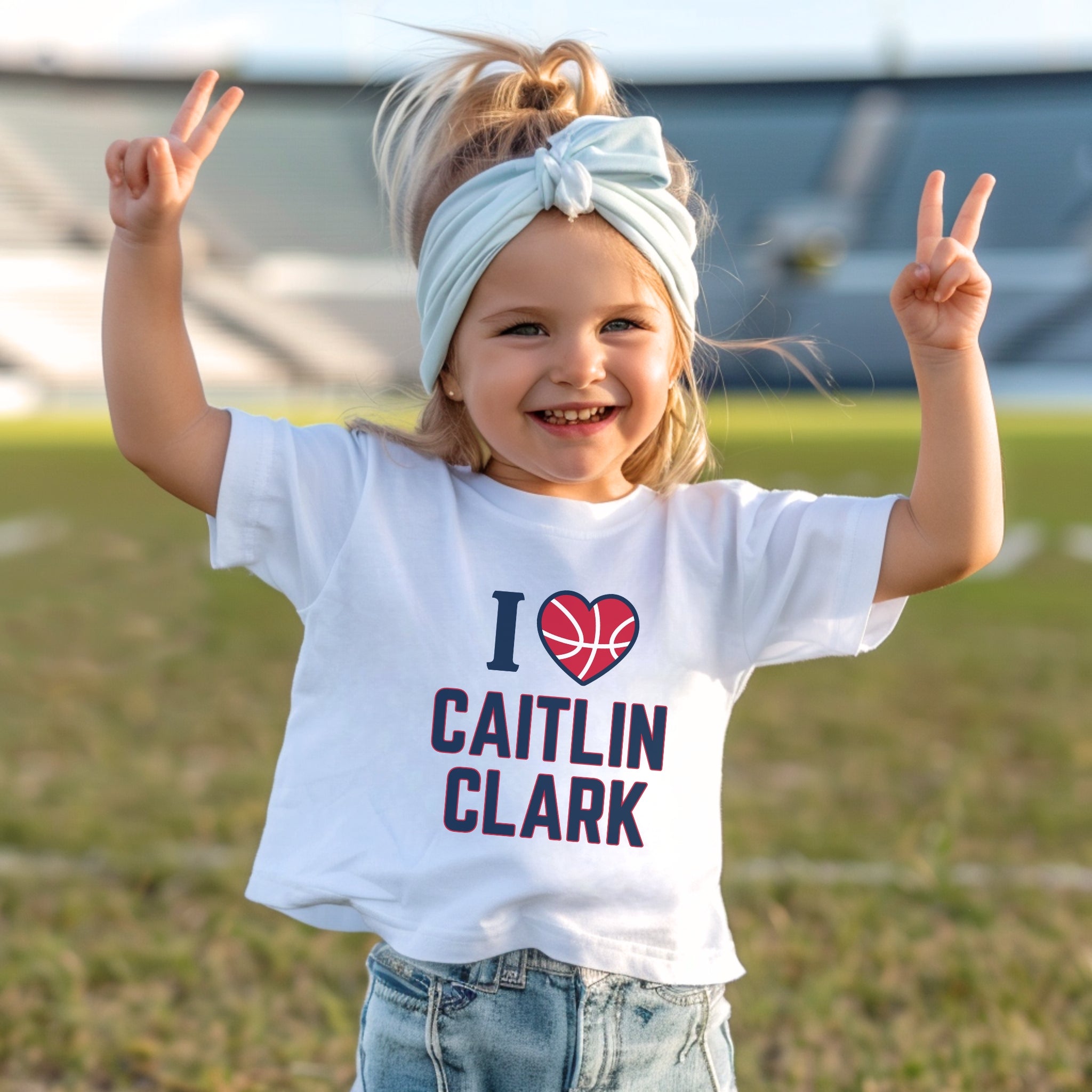 Little girl wearing white I love Caitlin Clark t-shirt
