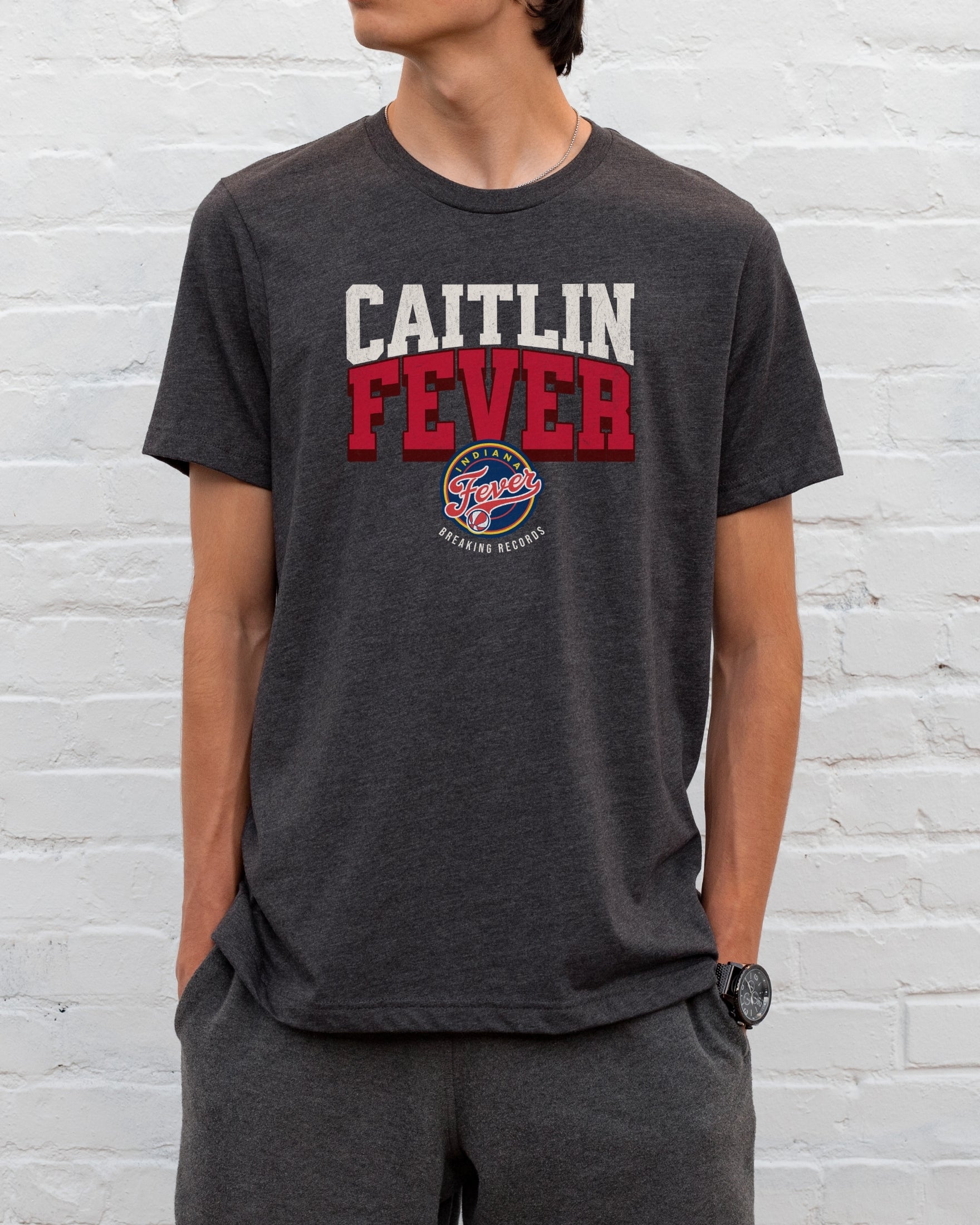 Man wearing dark grey heather Caitlin Fever shirt