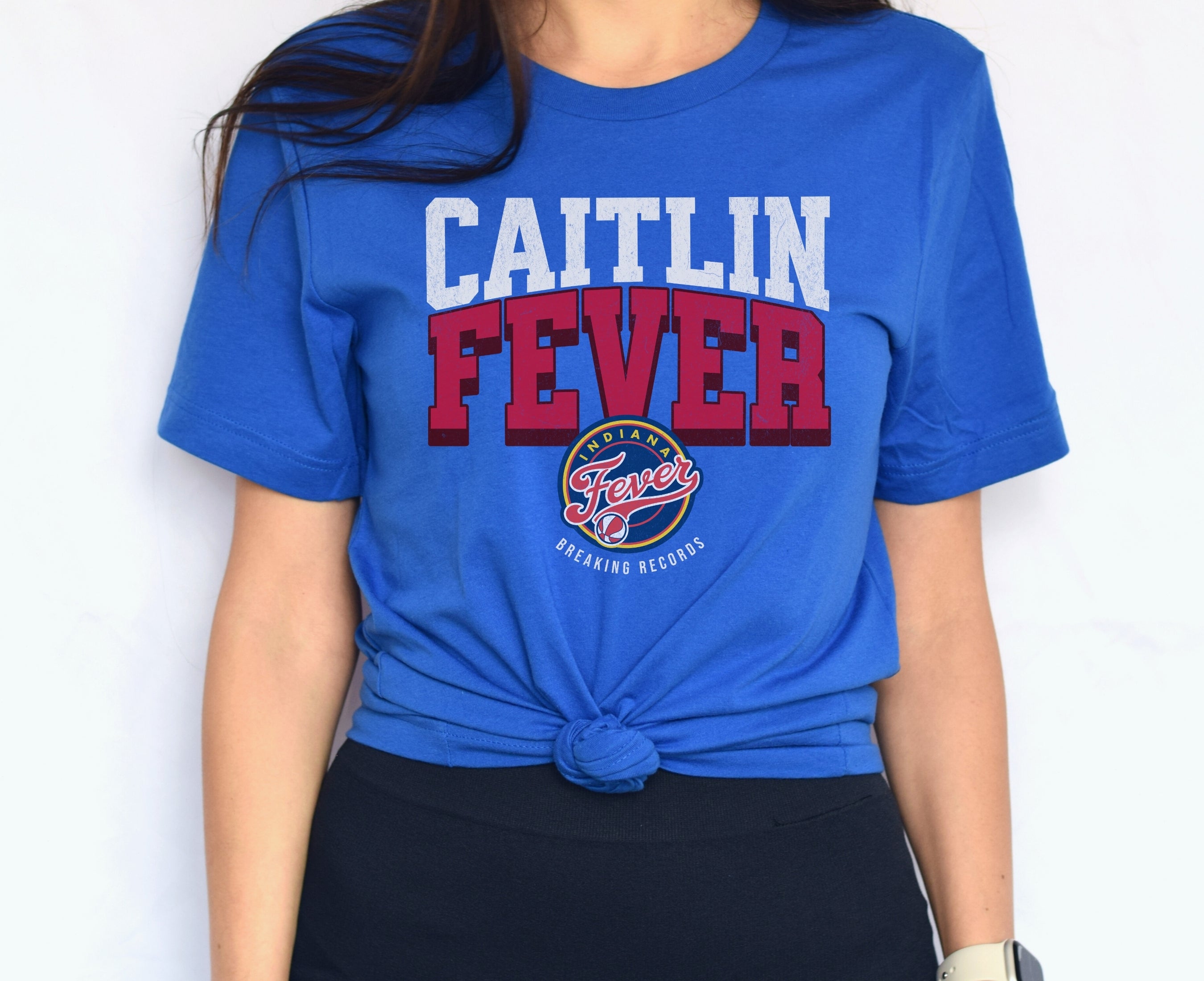 Woman wearing true royal blue Caitlin Clark Fever t-shirt