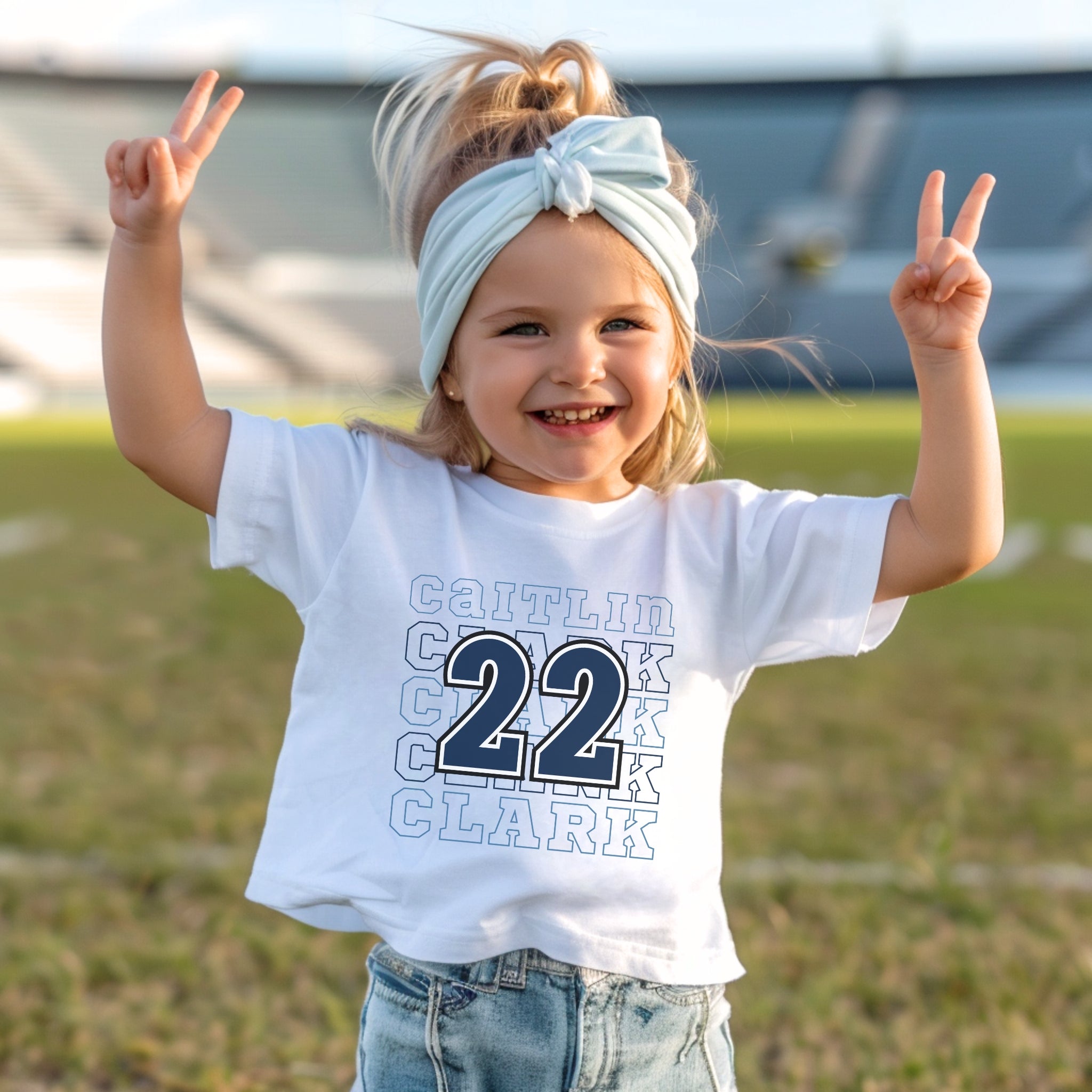 Little girl wearing white Caitlin Clark 22 Toddler T-Shirts