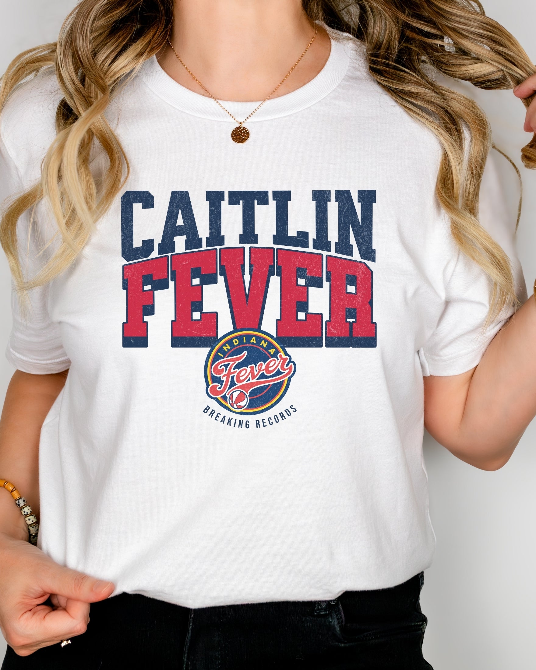 Girl wearing white Caitlin Fever shirt