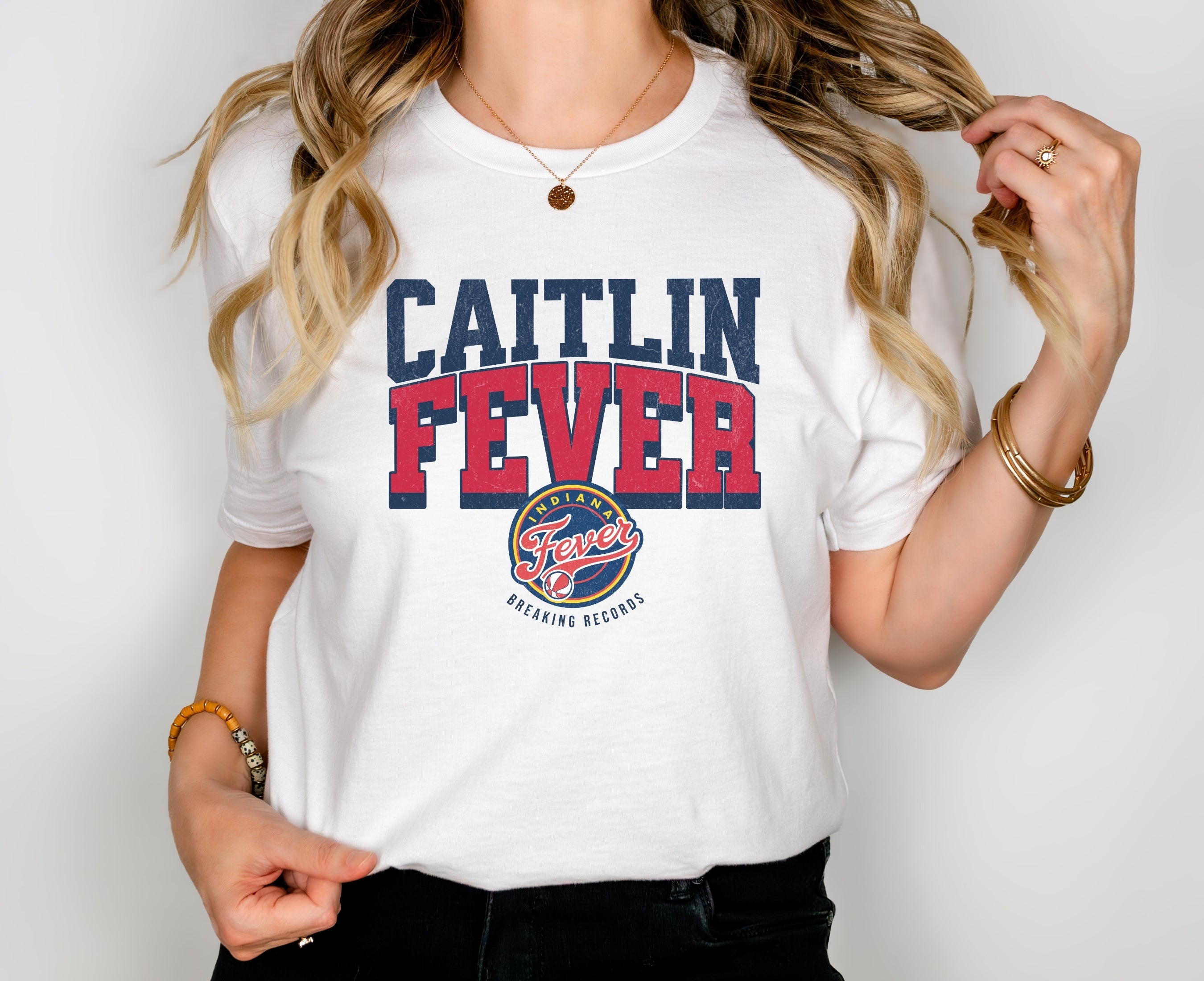 Girl wearing white Caitlin Fever shirt