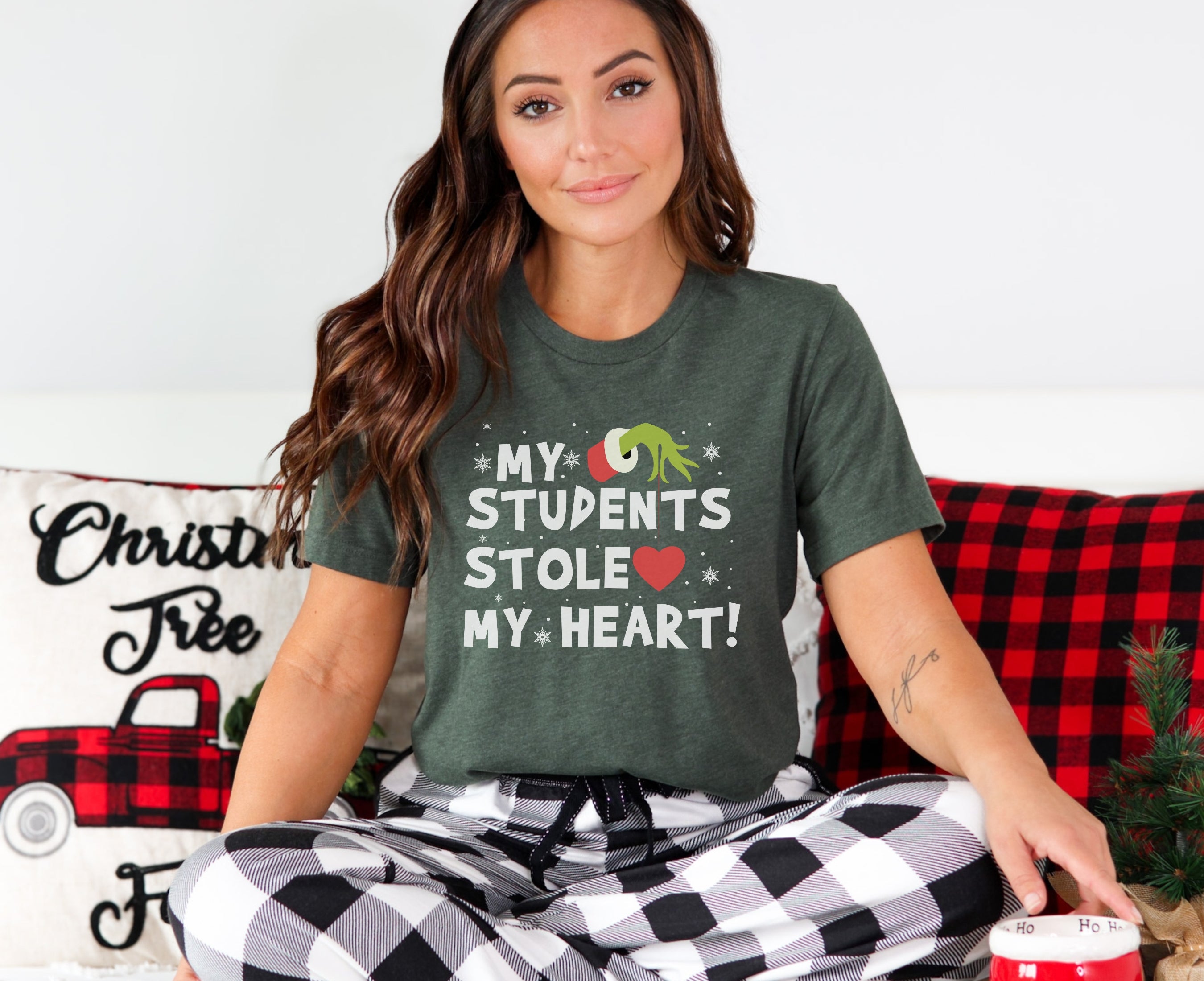 Woman wearing heather forest t-shirt that reads my students stole my heart