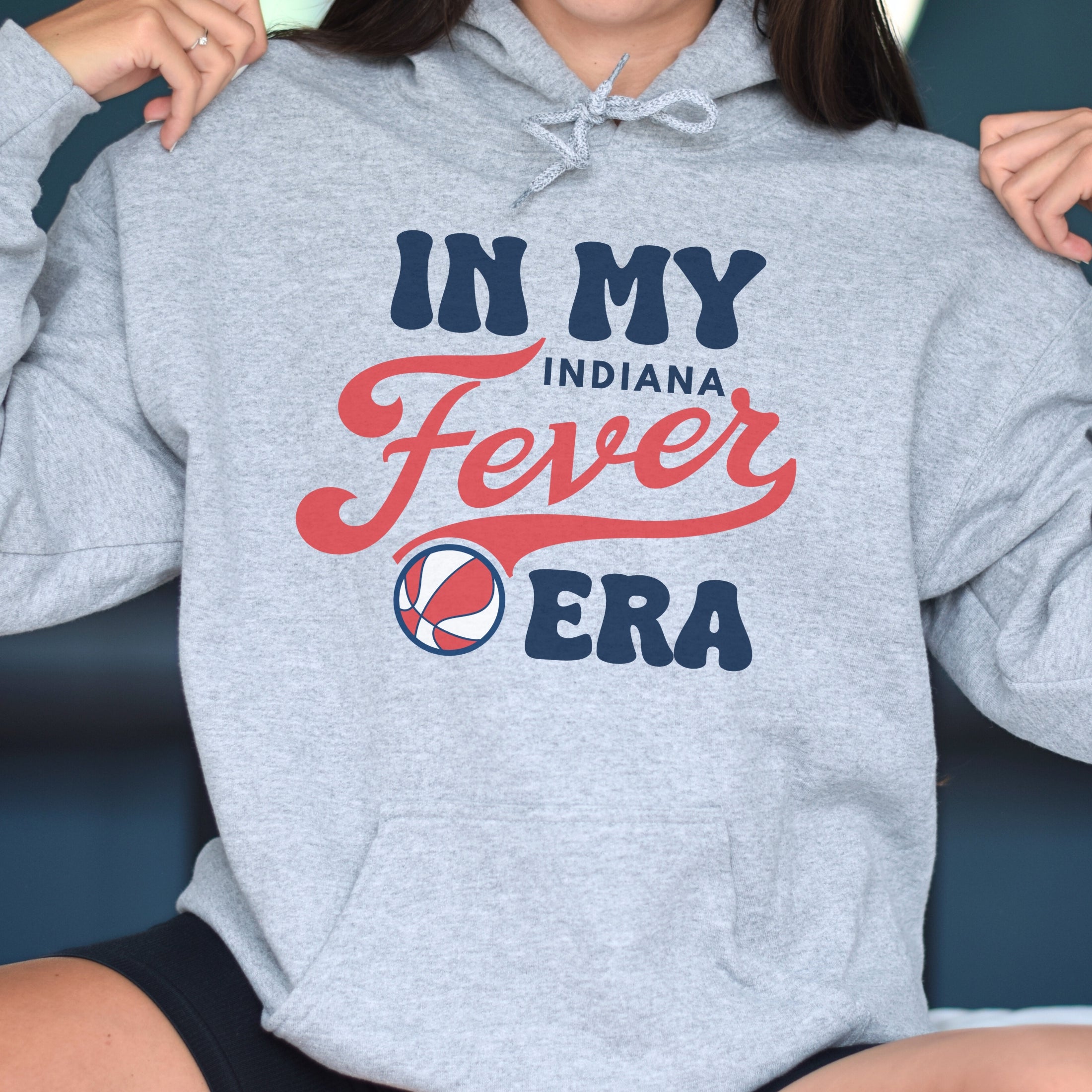 Girl wearing athletic heather in my Fever era hoodie