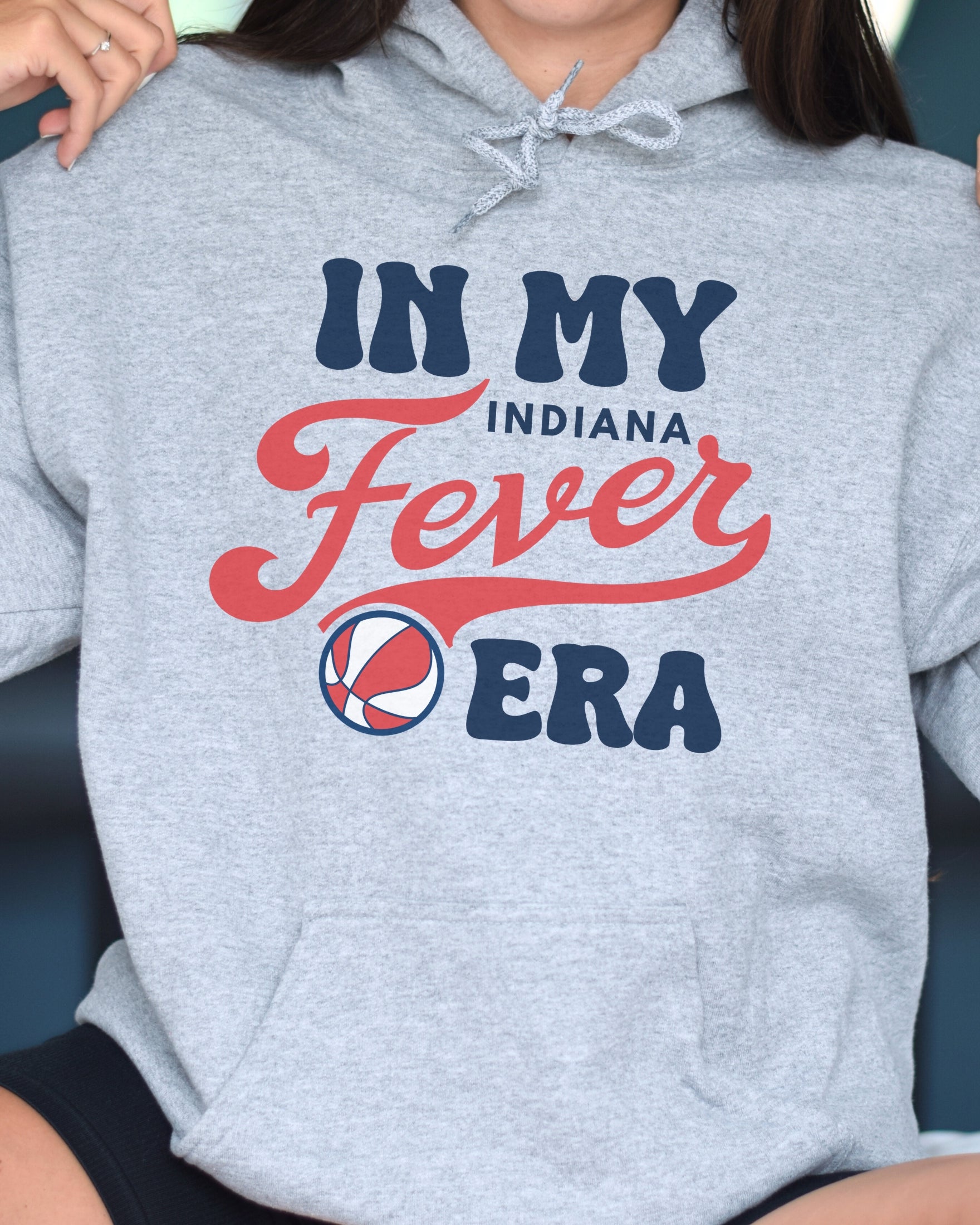 Girl wearing athletic heather in my Fever era hoodie