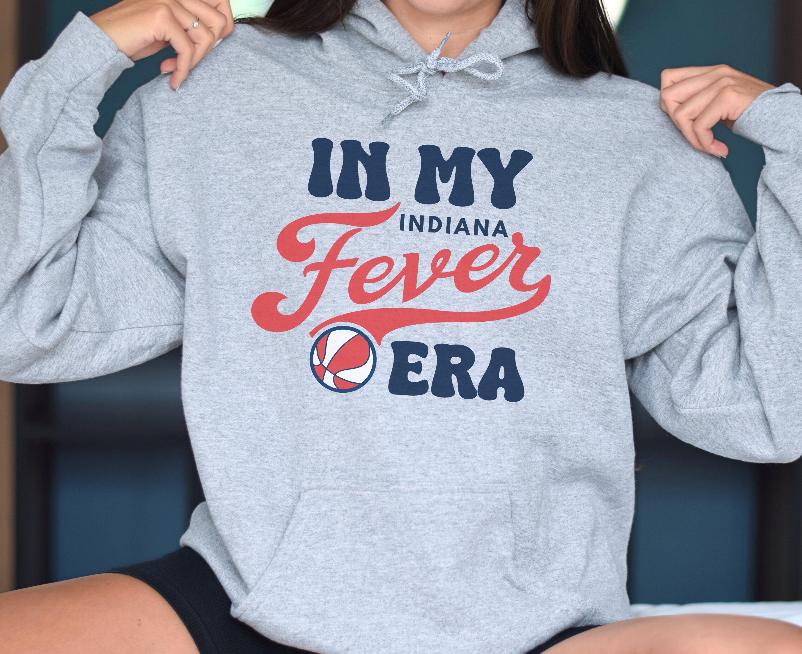 Girl wearing athletic heather in my Fever era hoodie