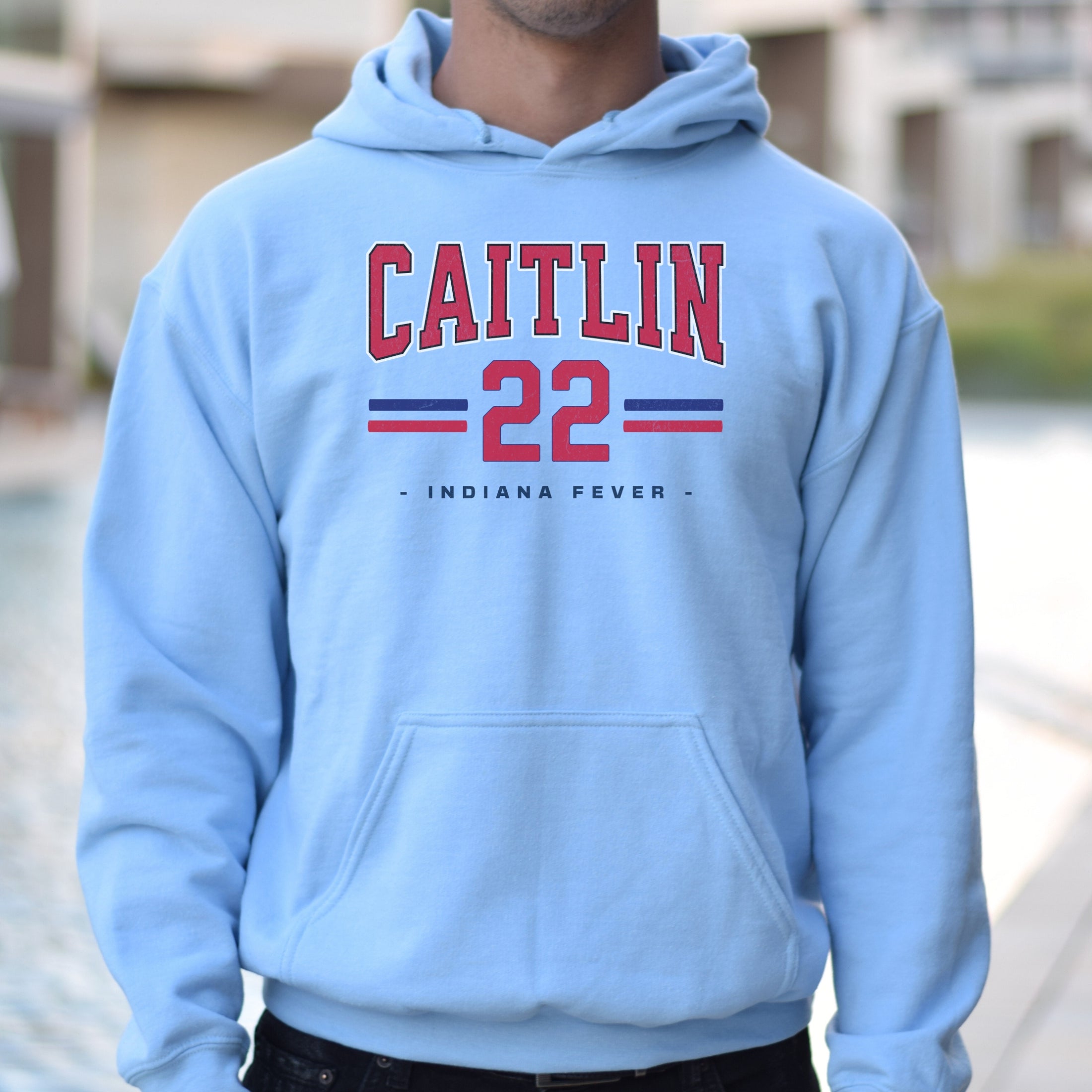Guy wearing light blue Caitlin Clark 22 Hoodie