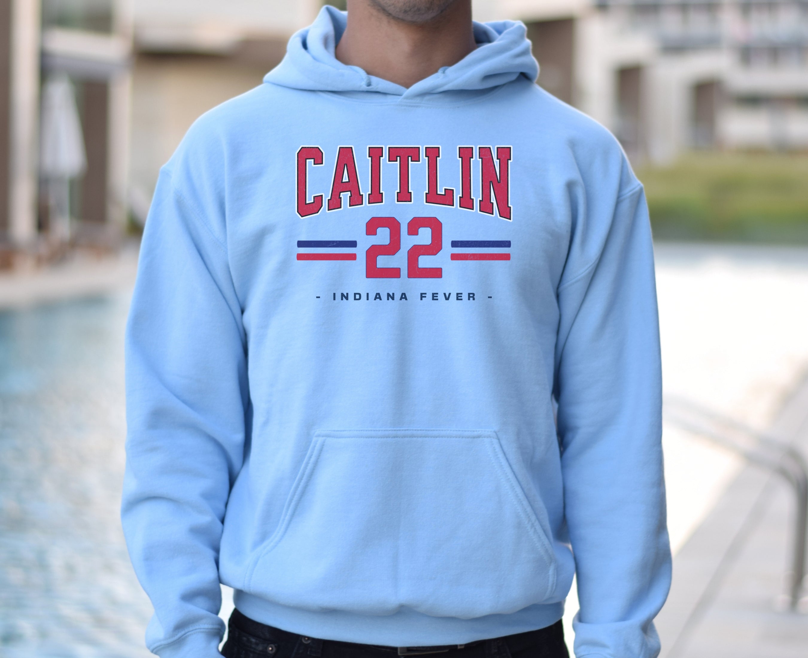 Guy wearing light blue Caitlin Clark 22 Hoodie