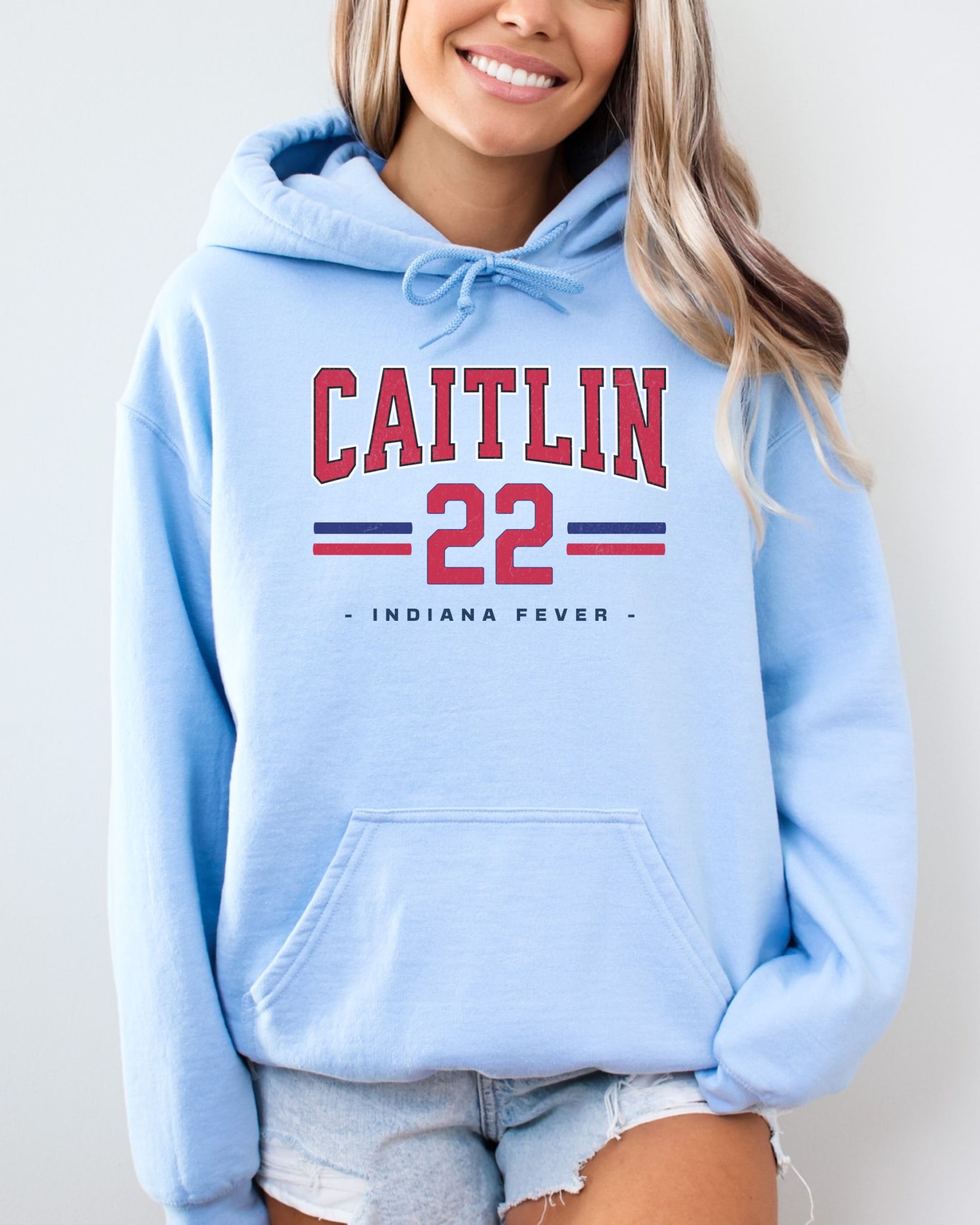 Girl wearing oversized light blue Caitlin Clark 22 Hoodie