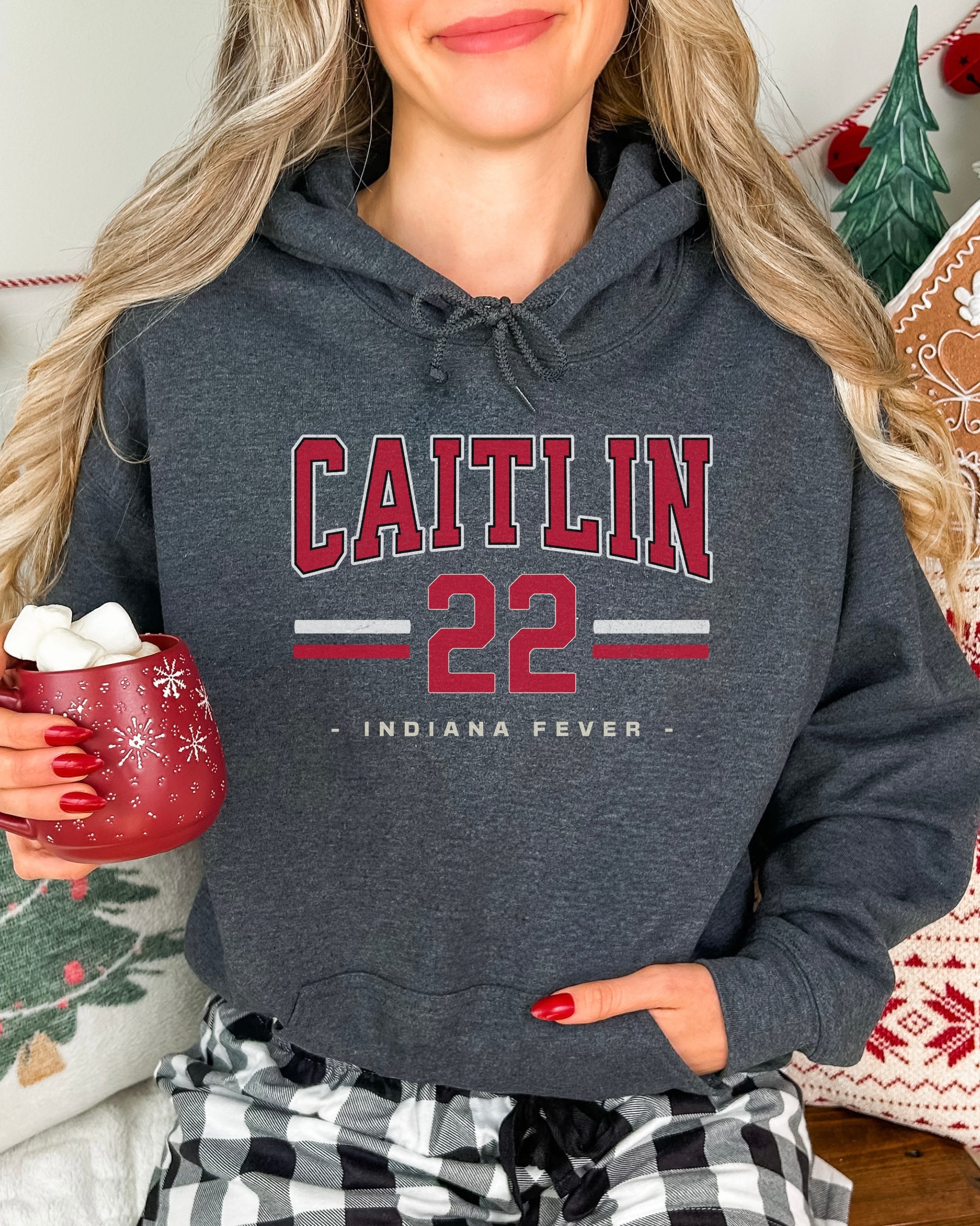 Woman wearing dark heather Caitlin Clark 22 Hoodie