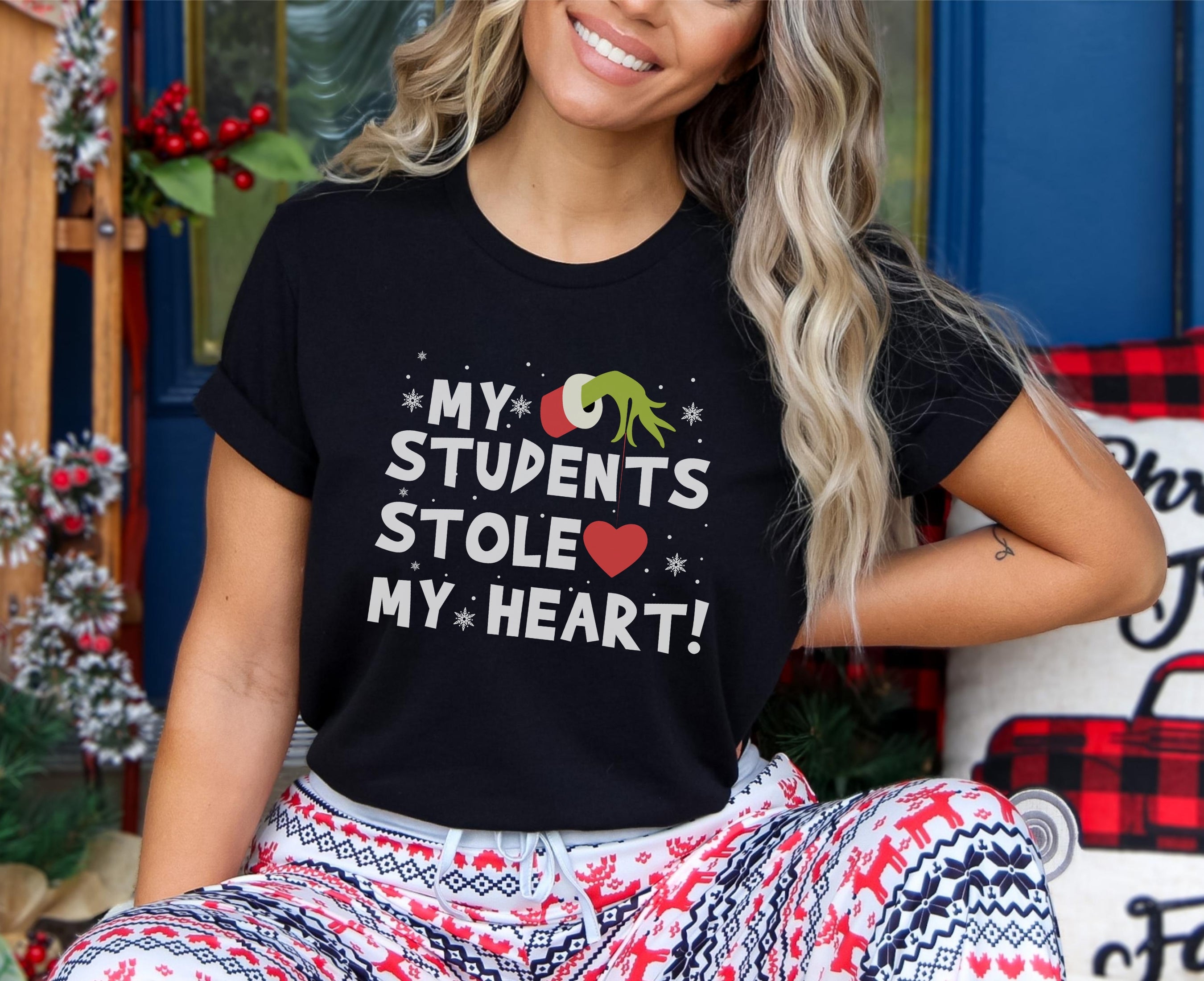 Woman wearing my students stole my heart t-shirt in black