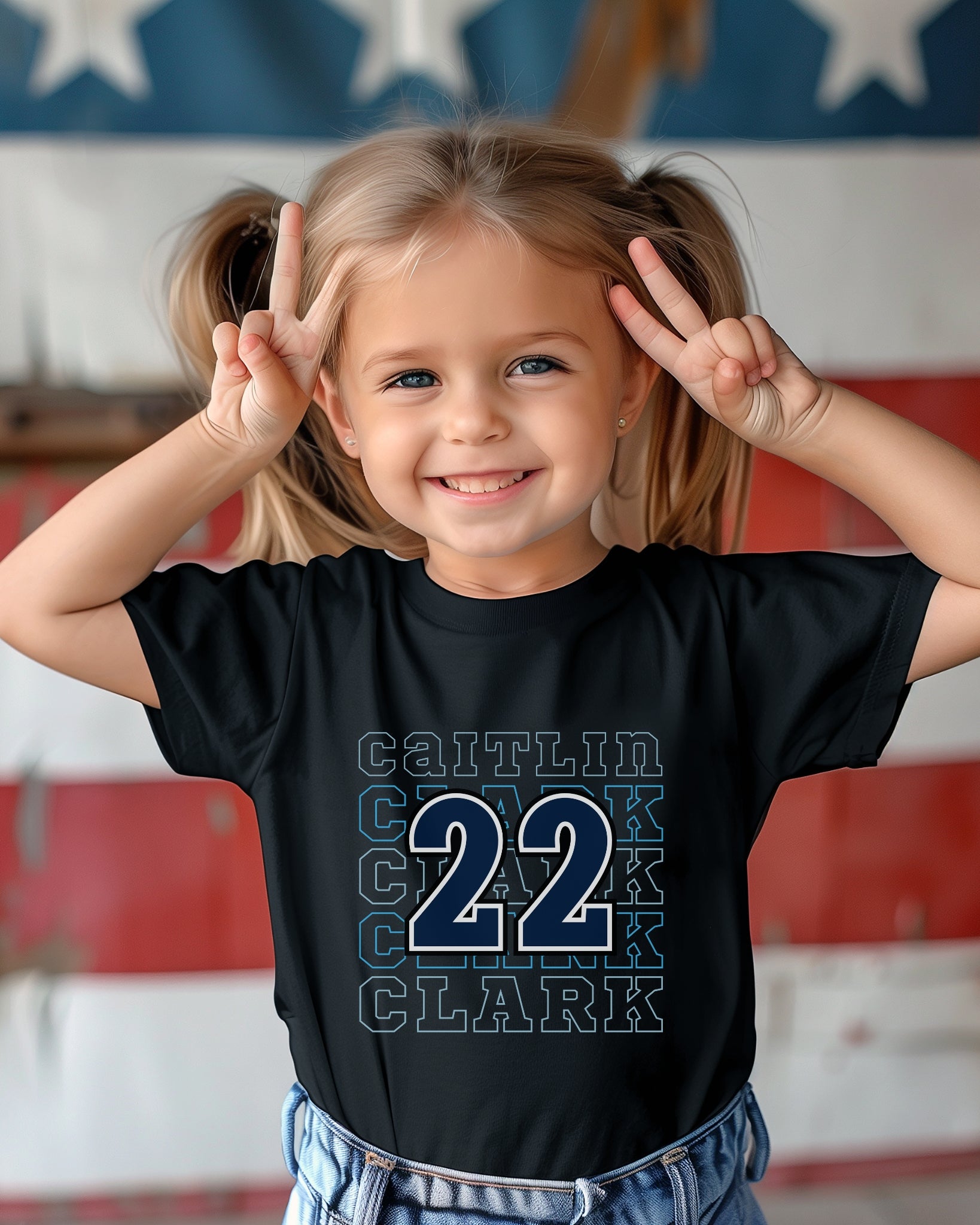 Little girl wearing black Caitlin Clark 22 Toddler Tee