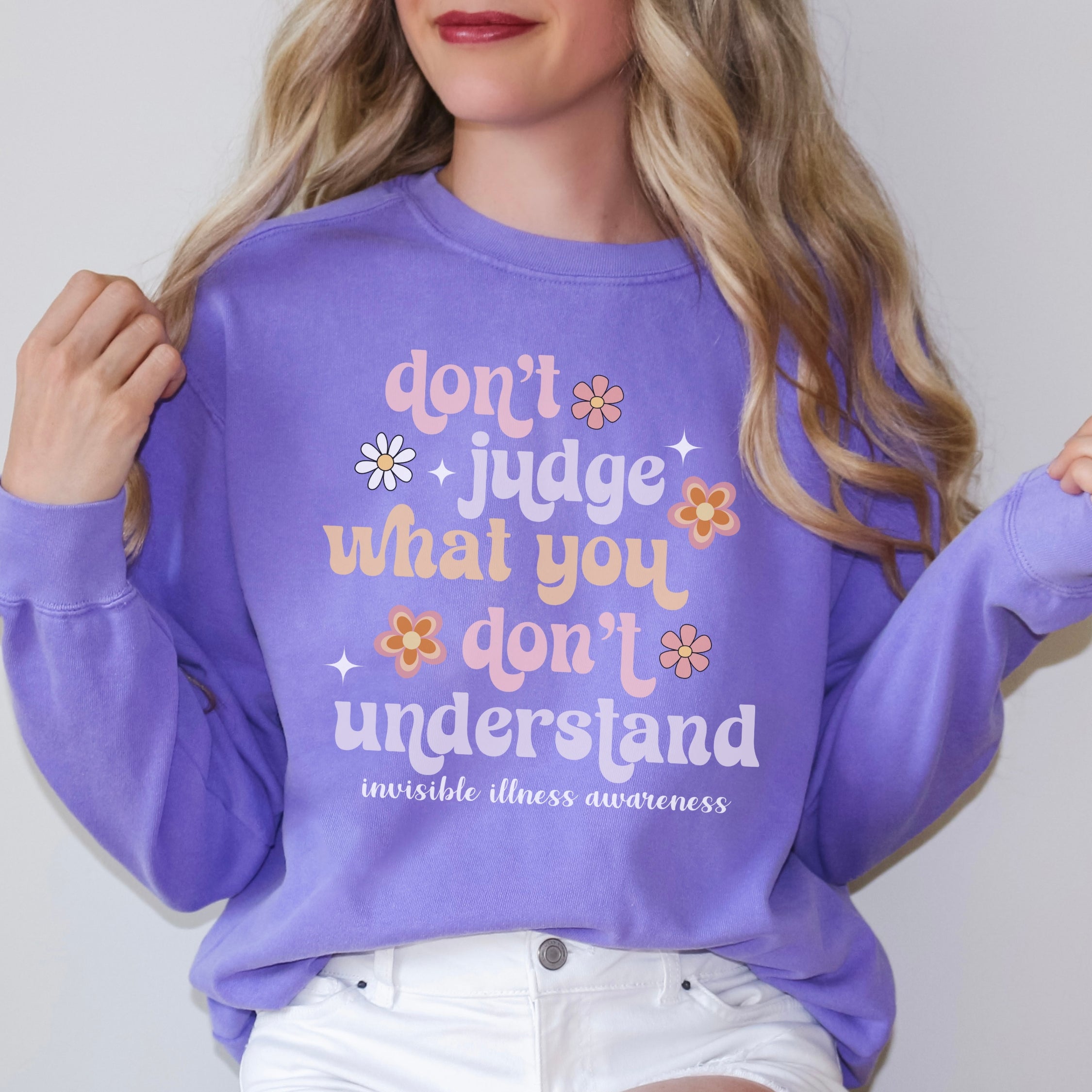 Girl wearing invisible illness Comfort Colors sweatshirt in violet