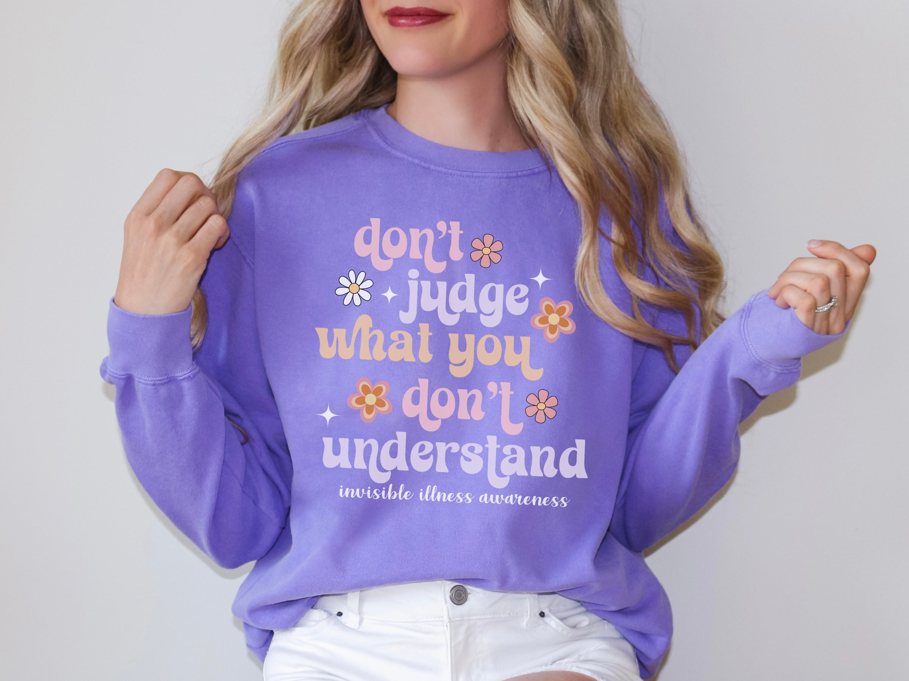 Girl wearing invisible illness Comfort Colors sweatshirt in violet