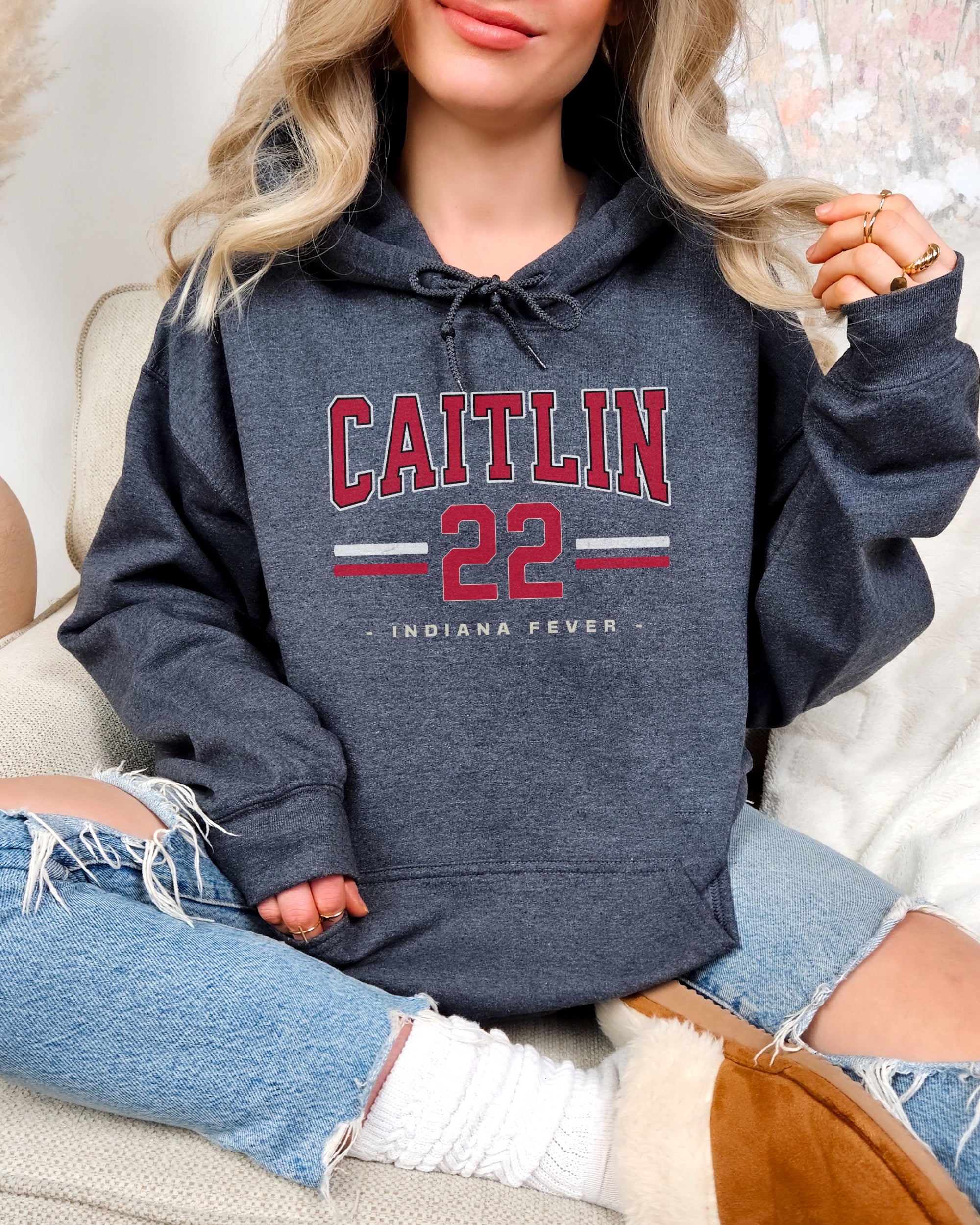 Woman wearing dark heather Caitlin Clark 22 Hoodie