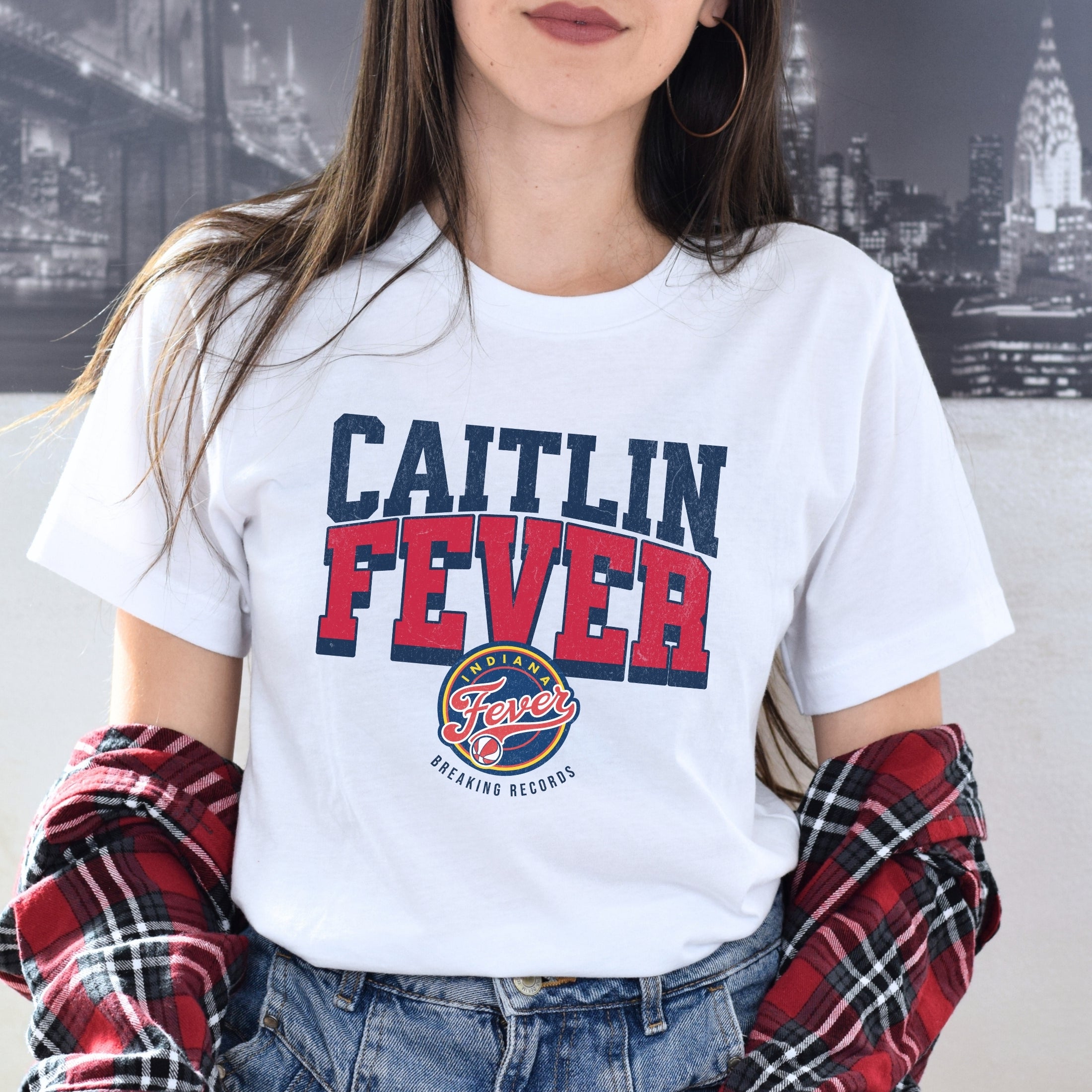 Woman wearing white Caitlin Clark Fever t-shirt