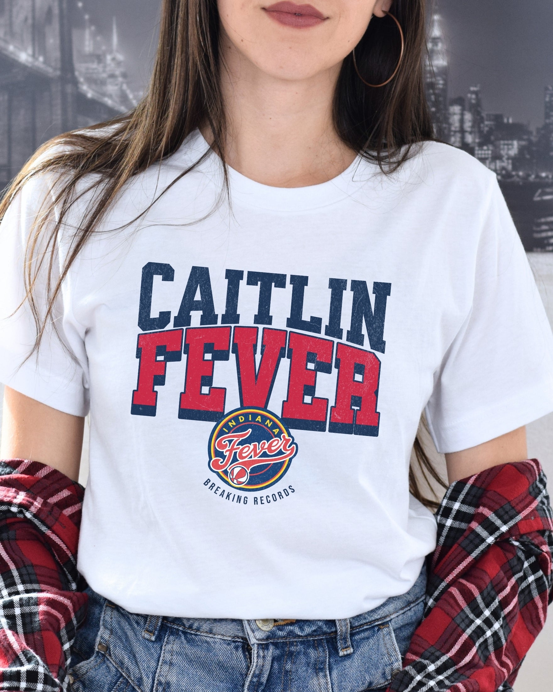 Woman wearing white Caitlin Clark Fever t-shirt