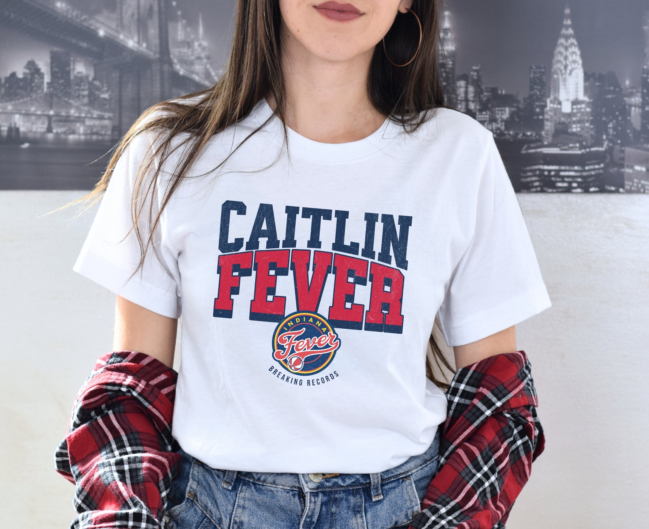 Woman wearing white Caitlin Clark Fever t-shirt