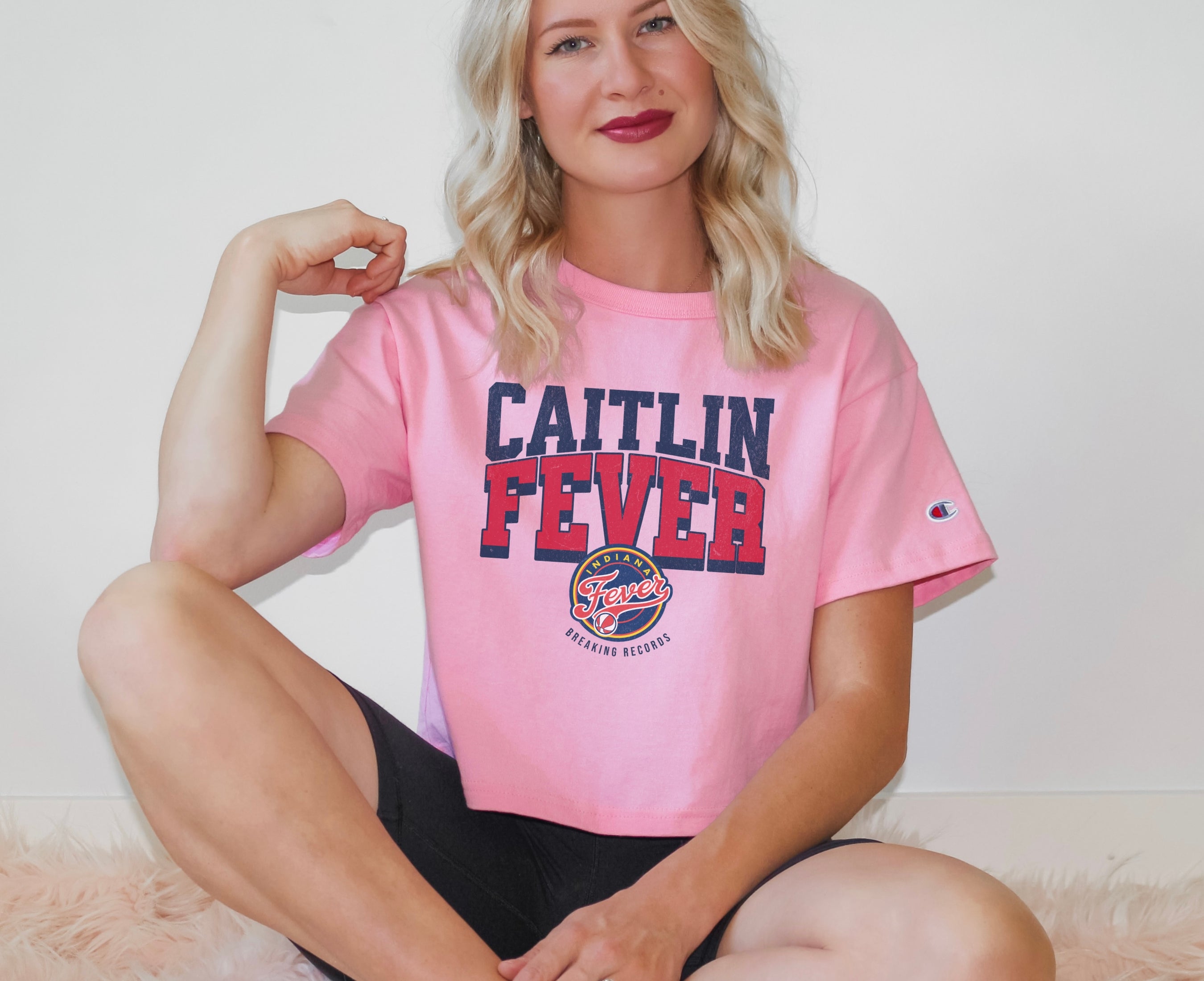 Girl wearing Champion Caitlin Fever Crop Top t-shirt in pink