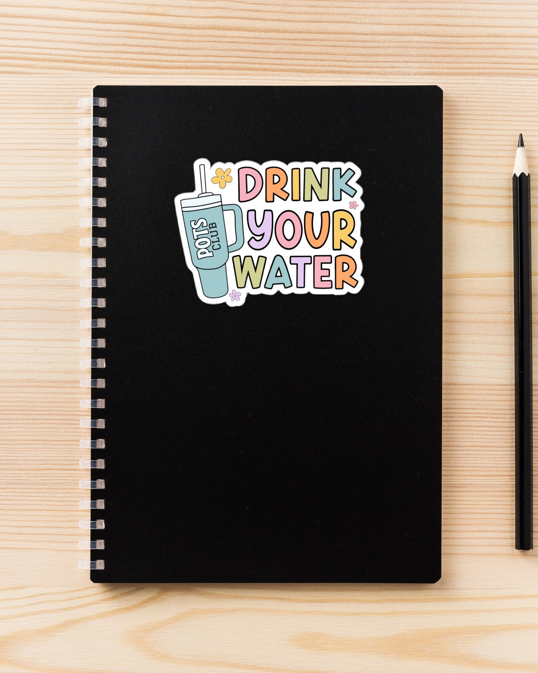 Drink your water sticker on notebook