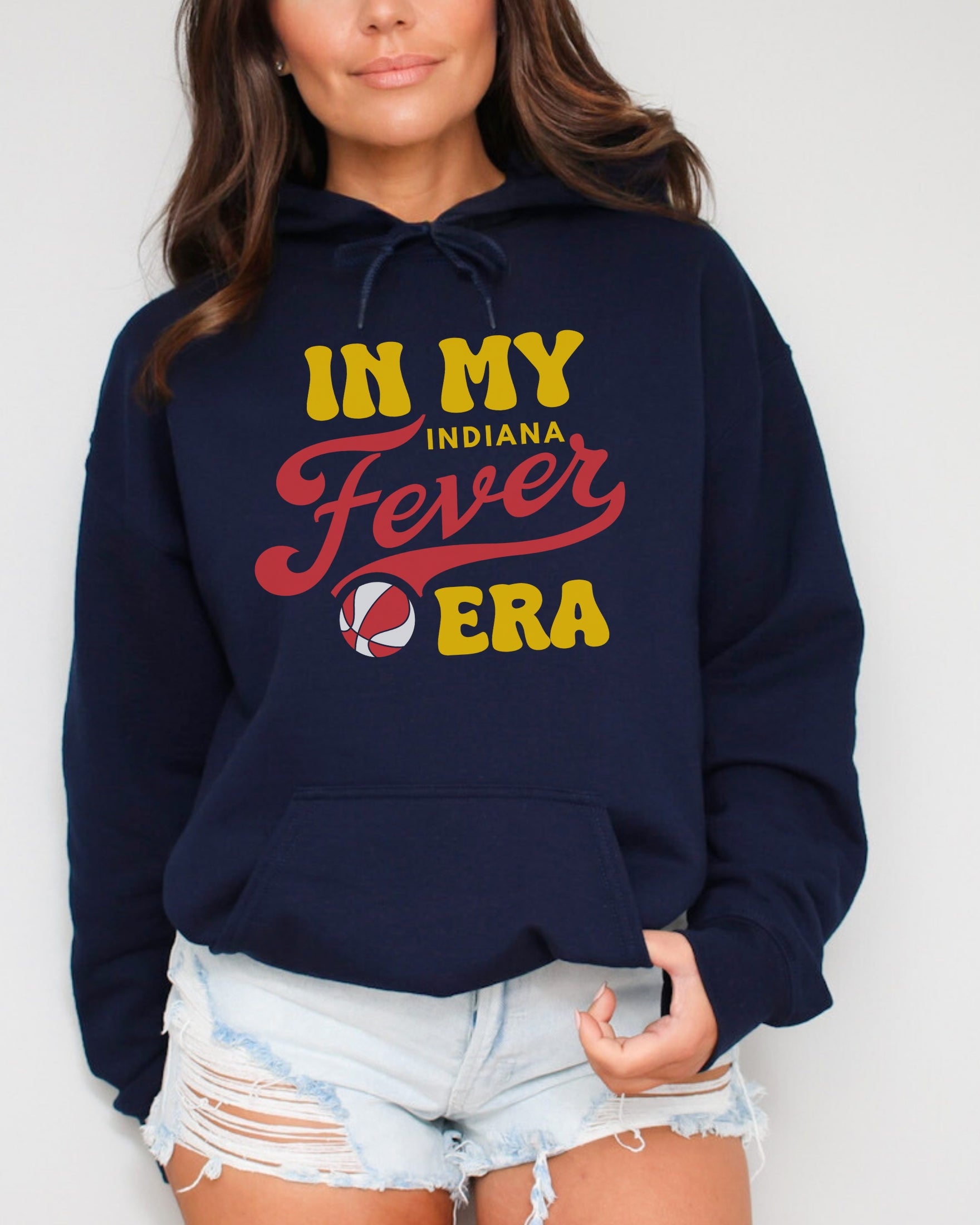 Woman wearing navy in my Fever era hoodie