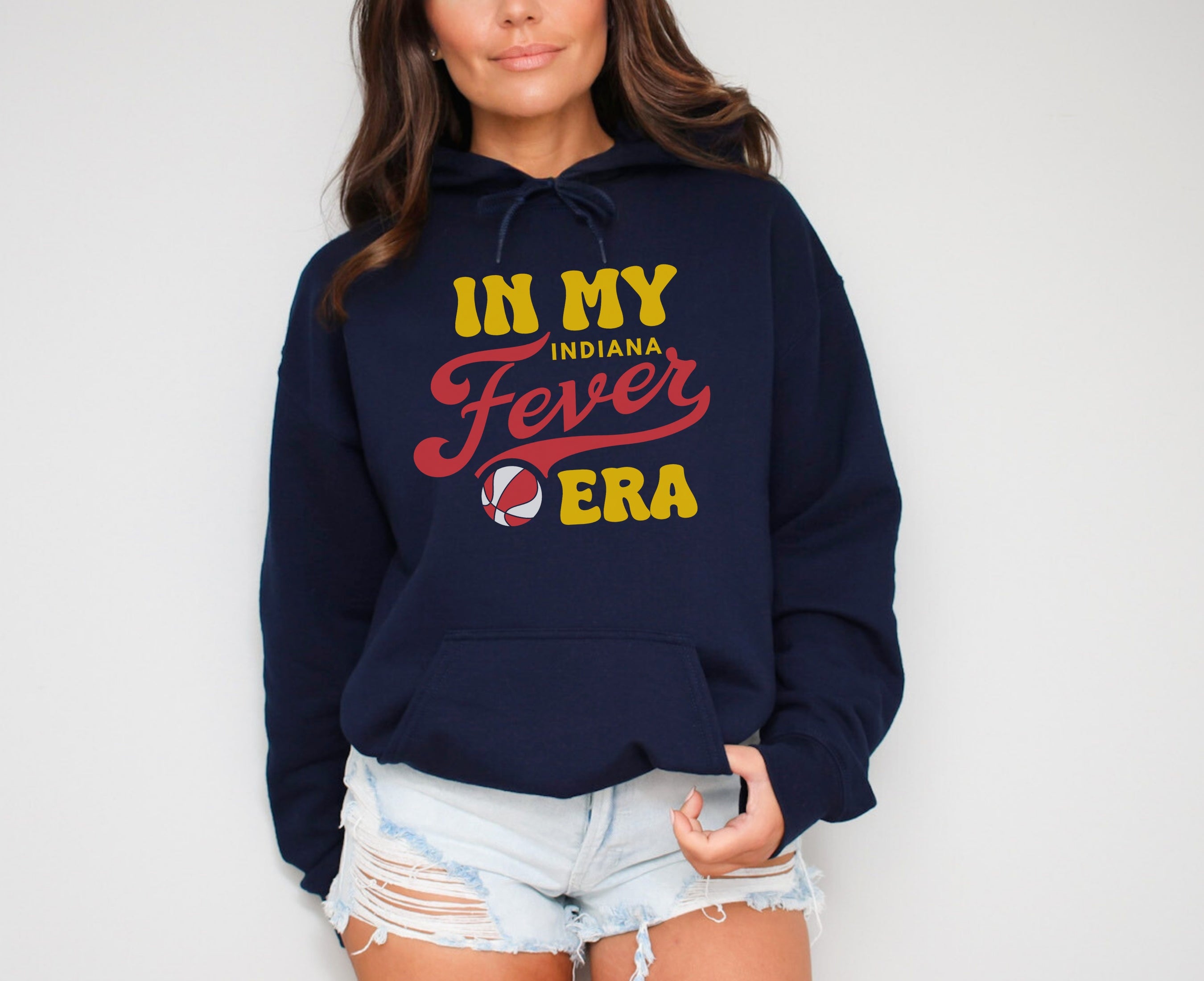Woman wearing navy in my Fever era hoodie