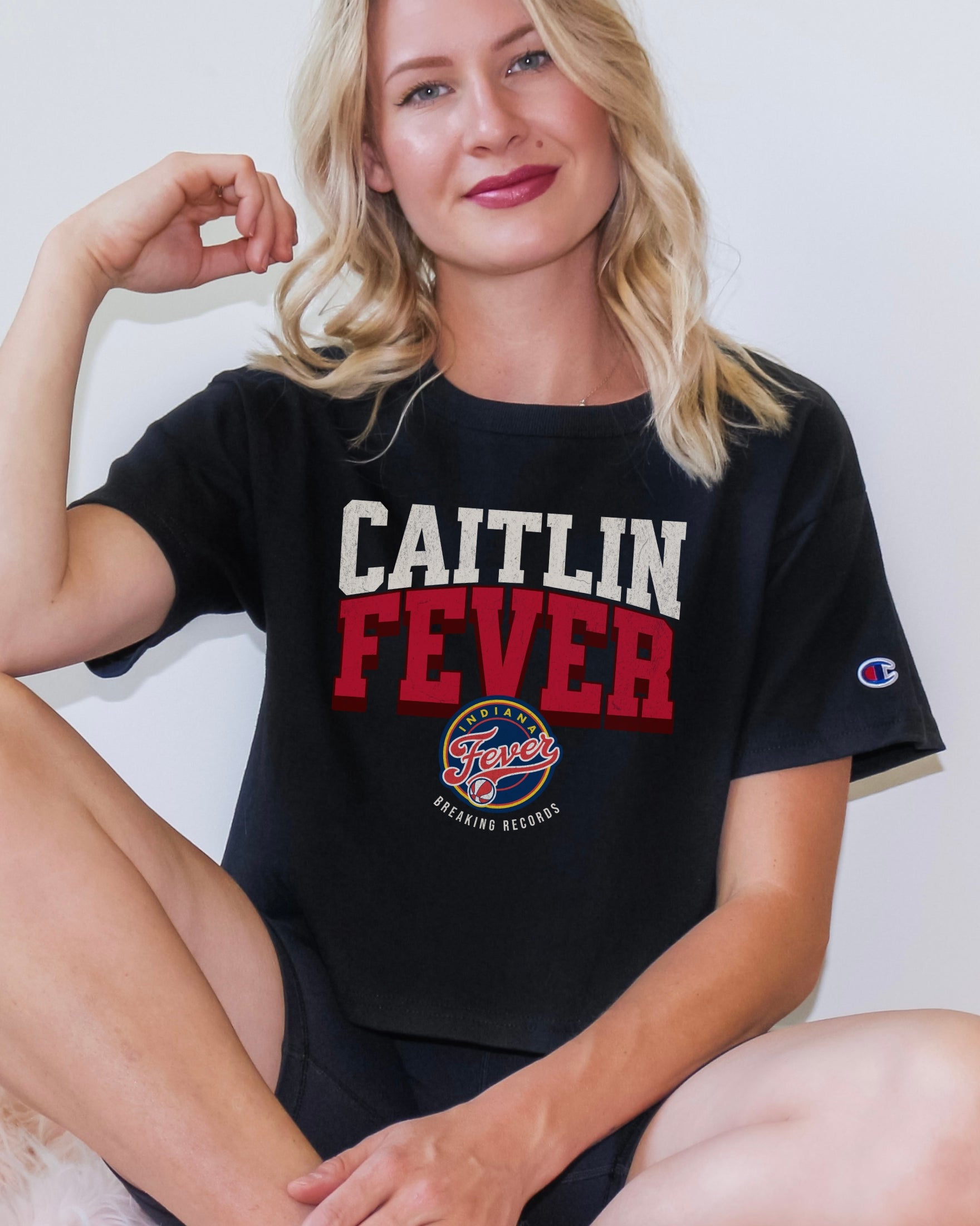 Girl wearing black Caitlin Clark Fever Crop Top