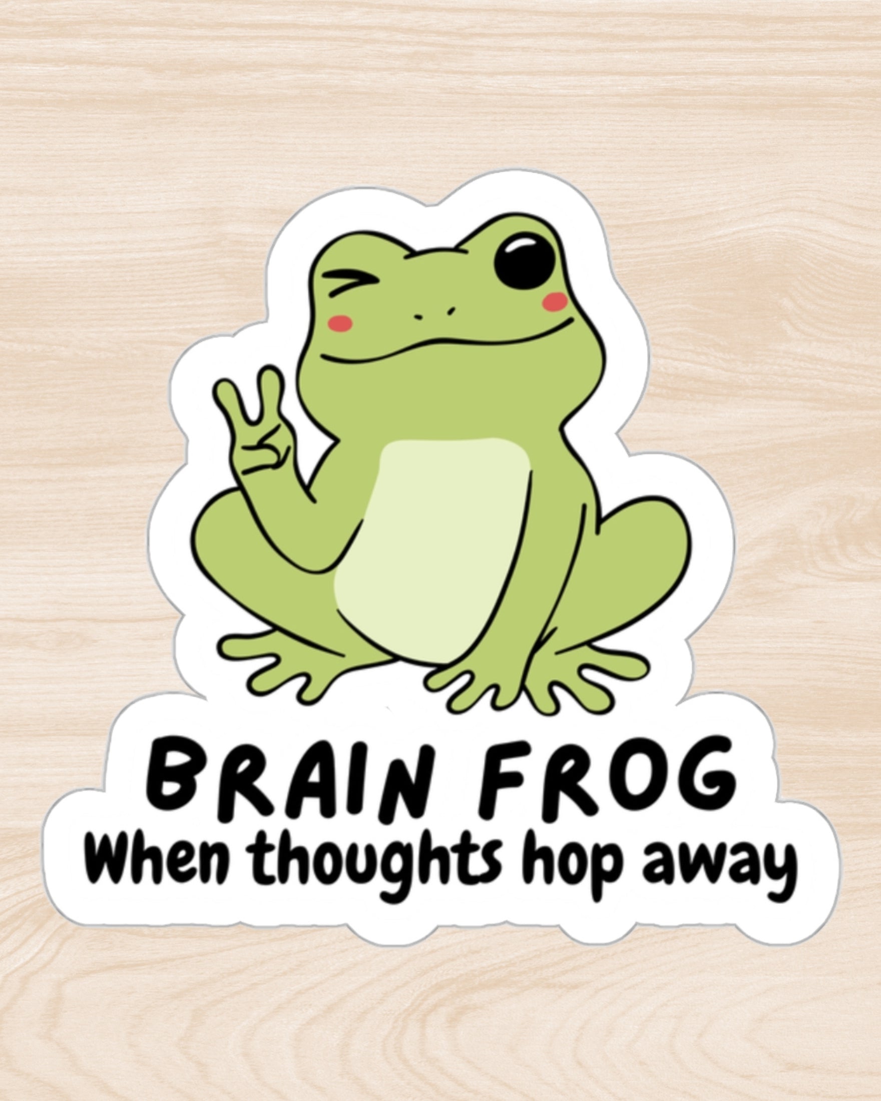 Sticker that says Brain Frog: When thoughts hop away - with a frog winking and giving the peace sign