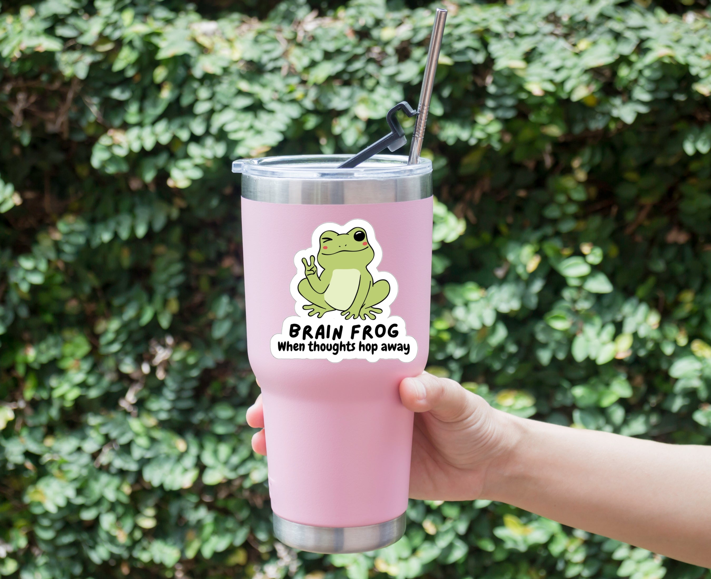 Sticker of a frog giving the peace sign for those with Brain Fog stuck on a tumbler
