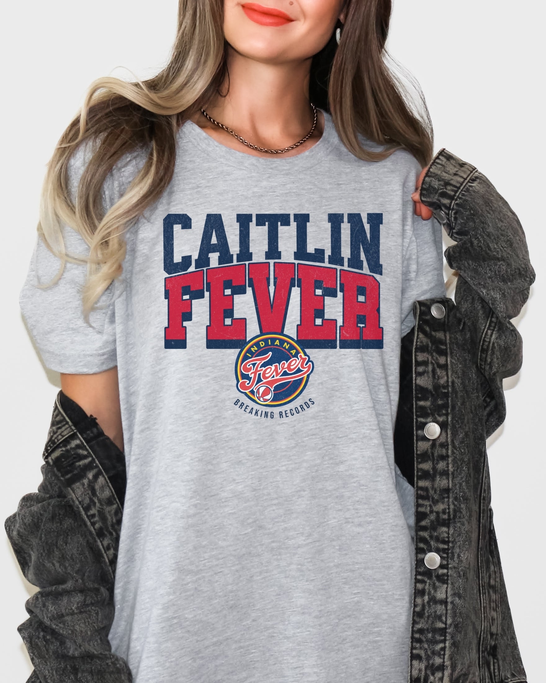 Girl wearing Athletic Heather Caitlin Fever shirt