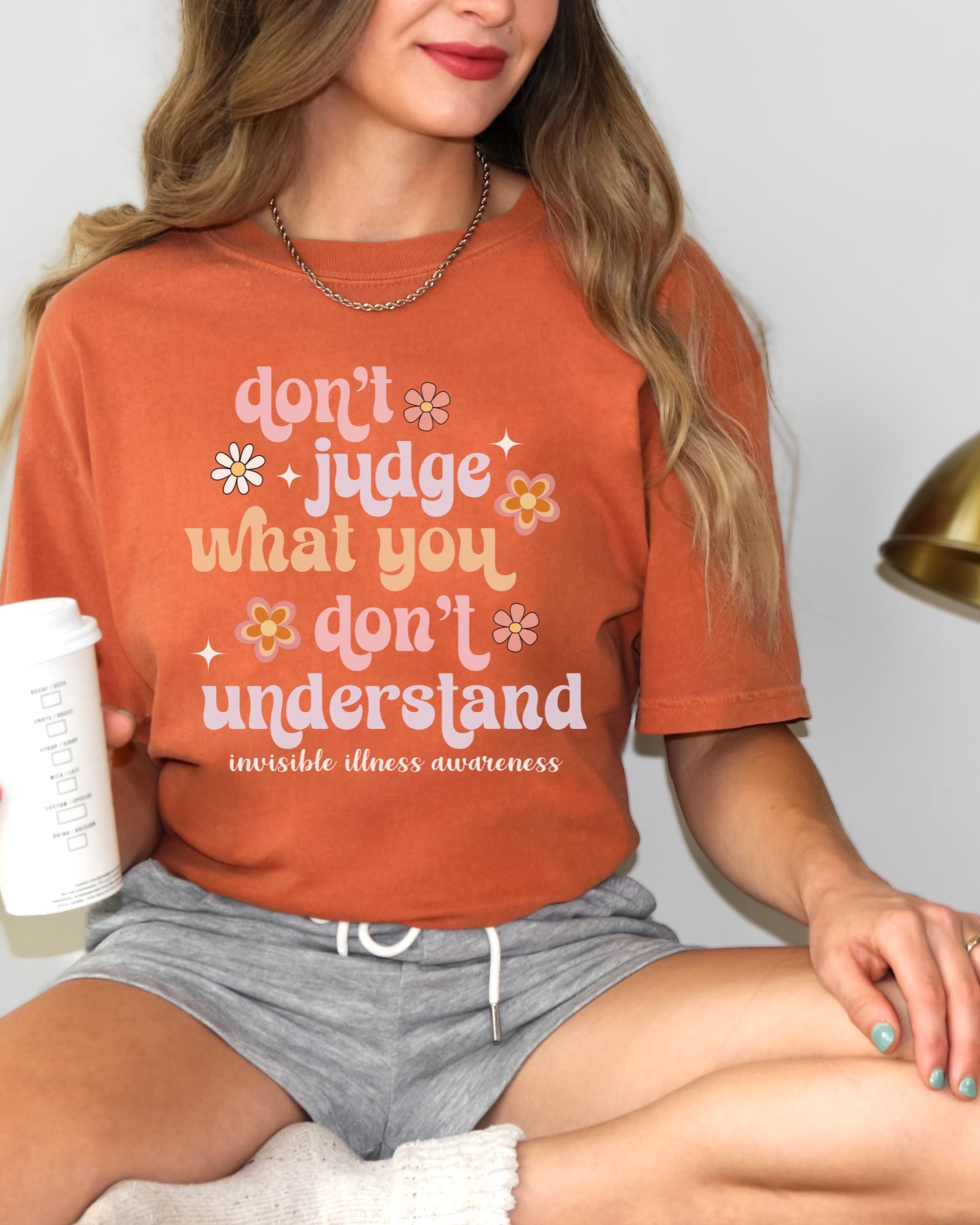 Girl wearing Comfort Colors invisible illness awareness shirt in yam