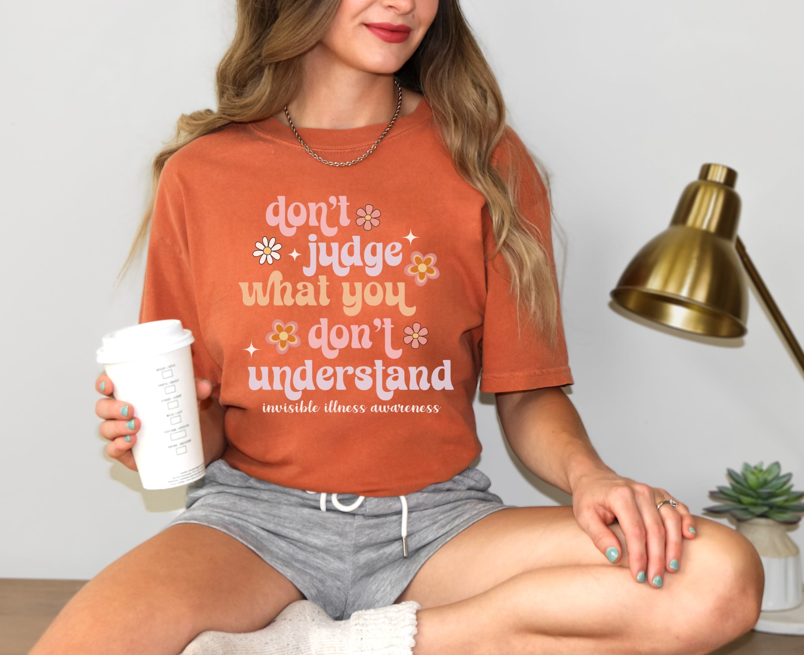 Girl wearing Comfort Colors invisible illness awareness shirt in yam