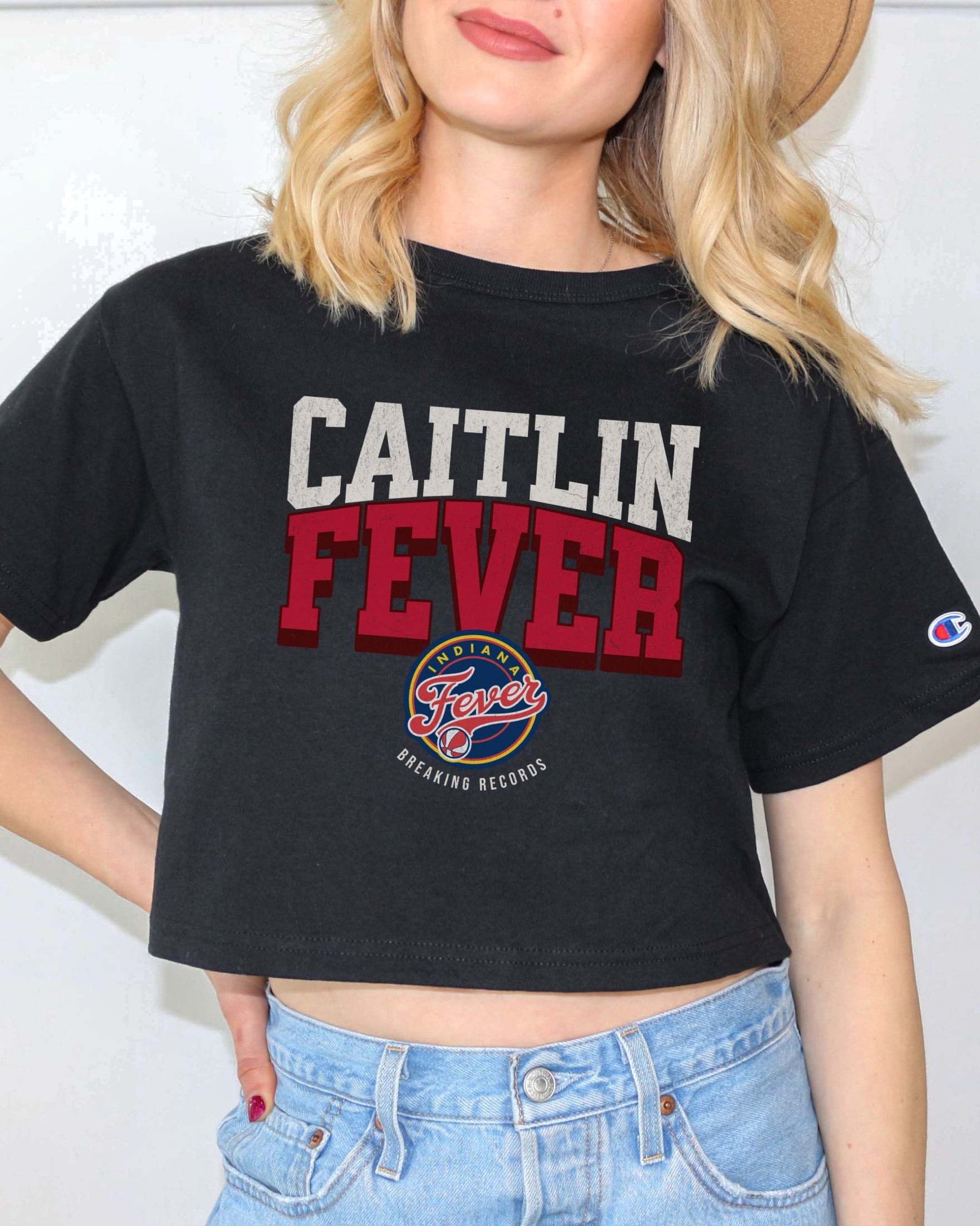 Girl wearing black Caitlin Fever Cropped t-shirt
