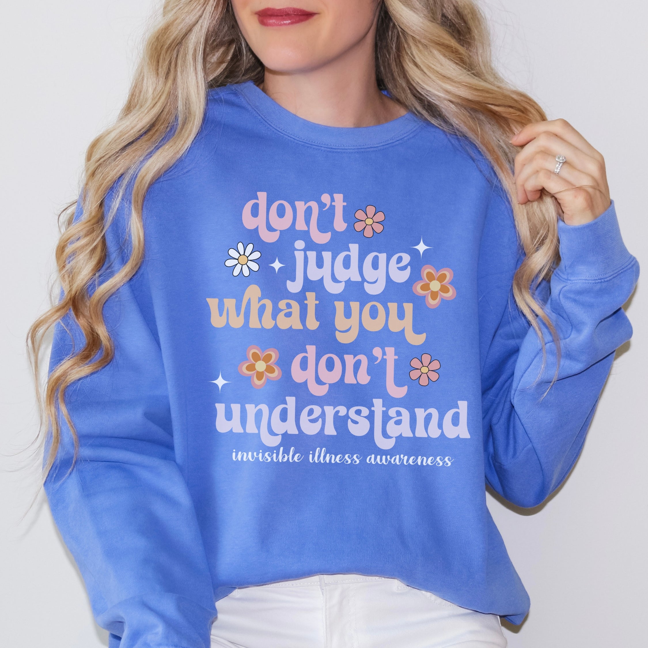 Girl wearing invisible illness Comfort Colors sweatshirt in flo blue