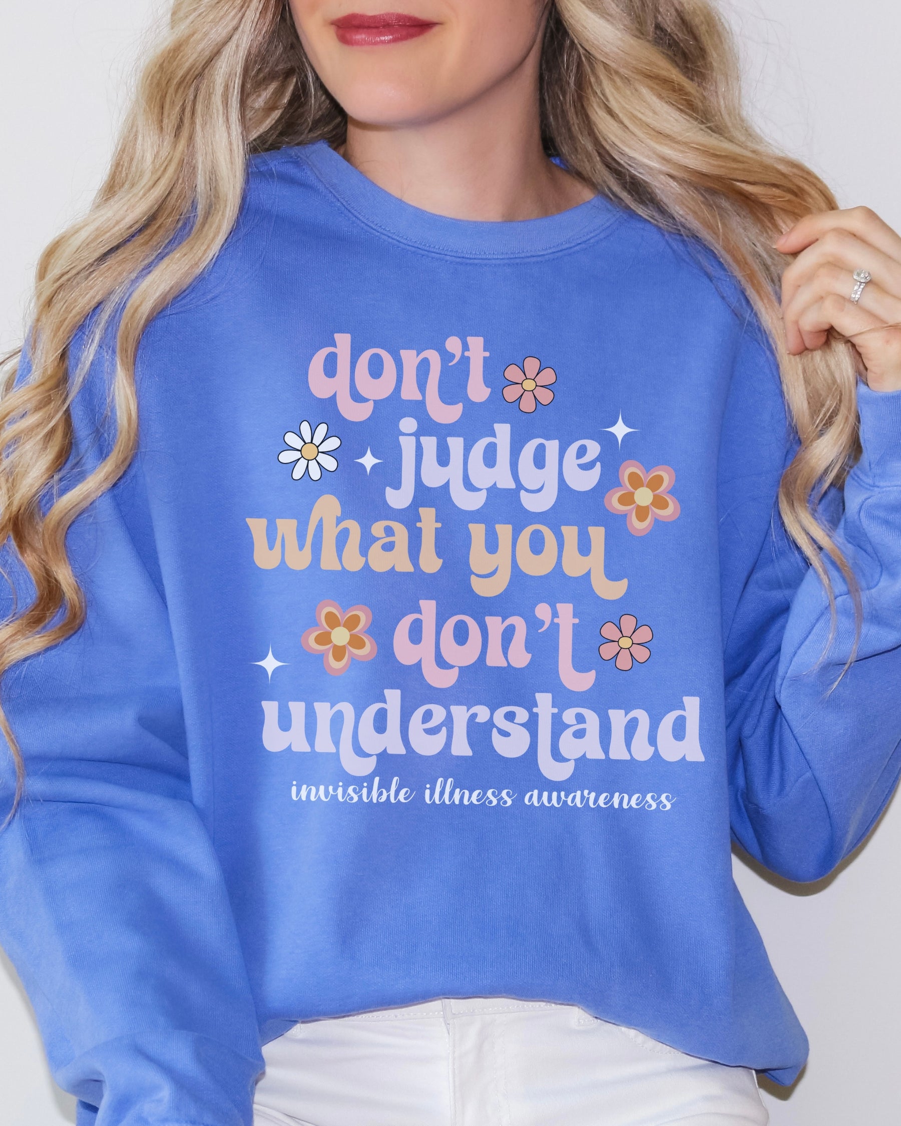Girl wearing invisible illness Comfort Colors sweatshirt in flo blue