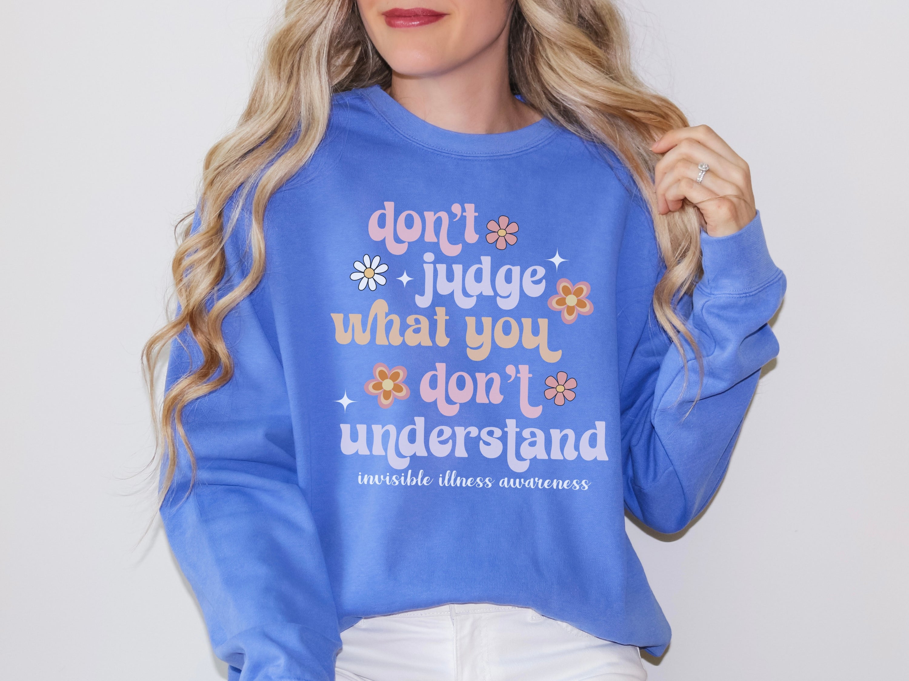 Girl wearing invisible illness Comfort Colors sweatshirt in flo blue